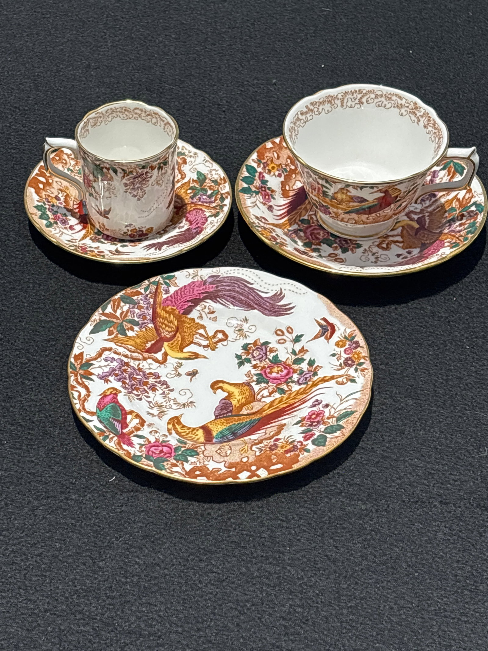 Tea cup, demi, saucers & side dish first quality Royal Crown Derby Olde Avesbury: Five piece First quality Olde Avesbury creamer & sugar, from Royal Crown Derby, a classic design that has been part of their collection since the 1930s. Key FeaturesDesign: Intricate birds and flowers