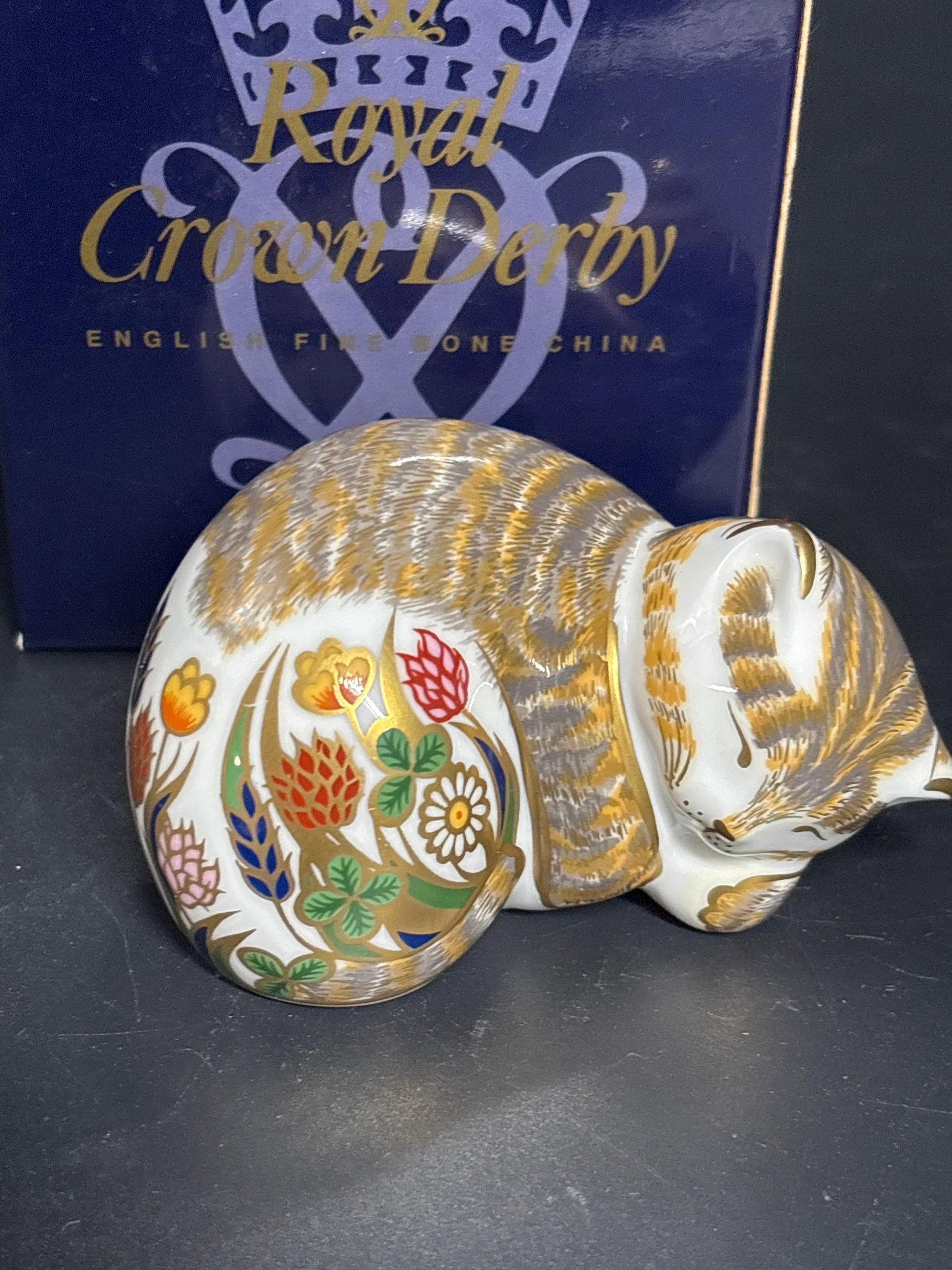 2001 Royal Crown Derby ‘Cottage Garden Kitten’ 3 inch paperweight: Gold stopper with replacement box. Royal Crown Derby paperweight in the form of a sleeping cat, specifically from the Cottage Garden collection. These decorative figurines are crafted from English fin