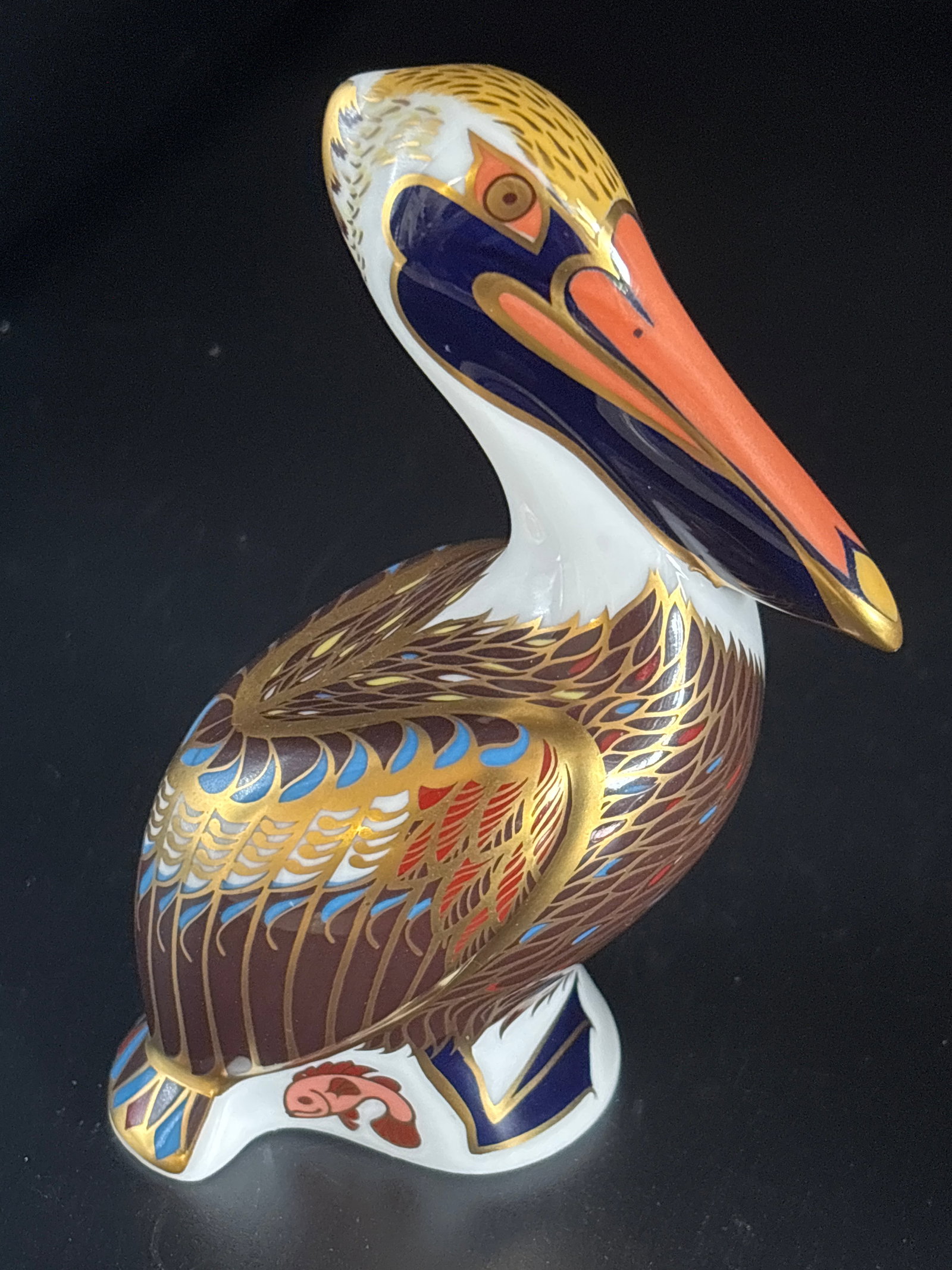 Brown Pelican Royal Crown Derby fine bone china 5 inch paperweight: Gold stopper, no box. Royal Crown Derby "Brown Pelican" fine bone china paperweight.Design & Collection DetailsManufacturer: Produced by the historic English porcelain manufacturer Royal Crown Derby.D