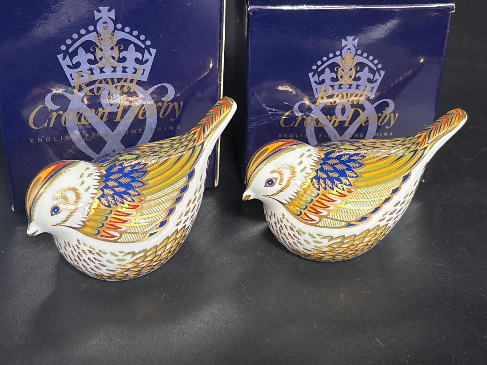 Collectors Guild Two desirable ‘Firecrest’ Royal Crown Derby Imari bone china paperweights: Gold stopper , with boxes. Royal Crown Derby "Firecrest" fine bone china paperweight.This collectible British porcelain bird features the brand's classic Imari-inspired styling, detailed with 22-karat