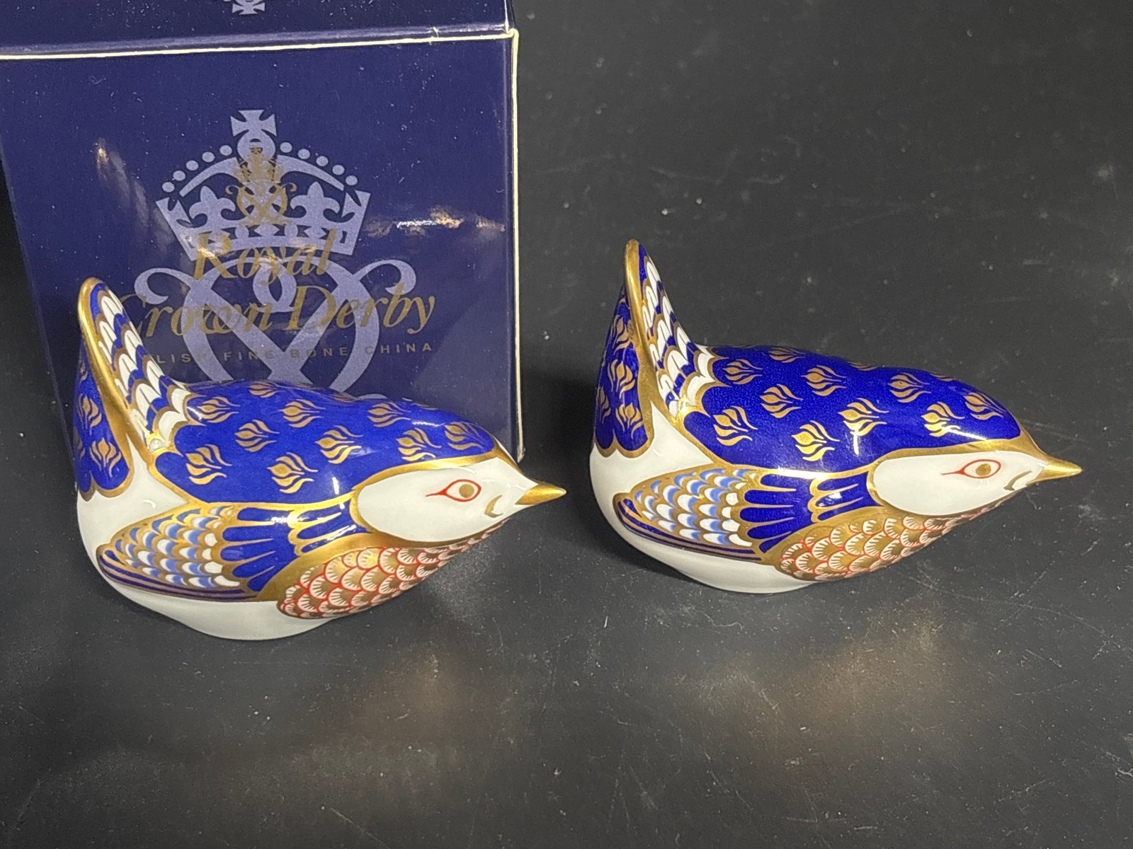 Two ‘Derby Wren’ Royal Crown Derby Imari bone china paperweights: One silver stopper and box, one no stopper or box. Two vintage Royal Crown Derby Imari Wren fine bone china paperweight. Handcrafted in England, this highly collectible porcelain figurine is styled in