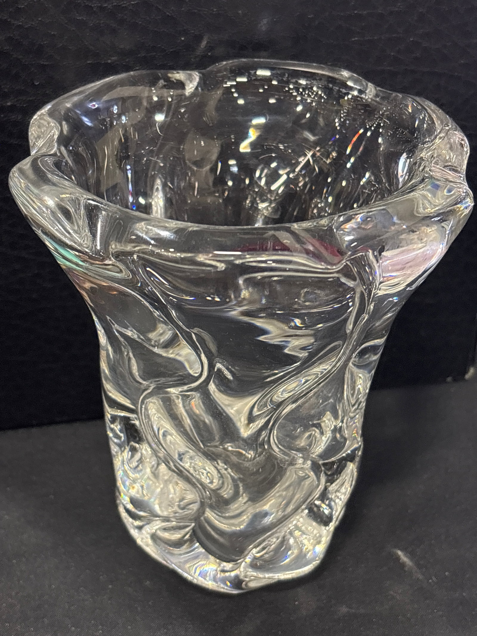 signed Daum France crystal glass organic, wavy, and sculptural form vase: Daum France crystal glass organic, wavy, and sculptural form vase. , a collectible art glass piece featuring a clear, streamlined design and the brand's signature marking. Brand: Daum FranceMaterial: 