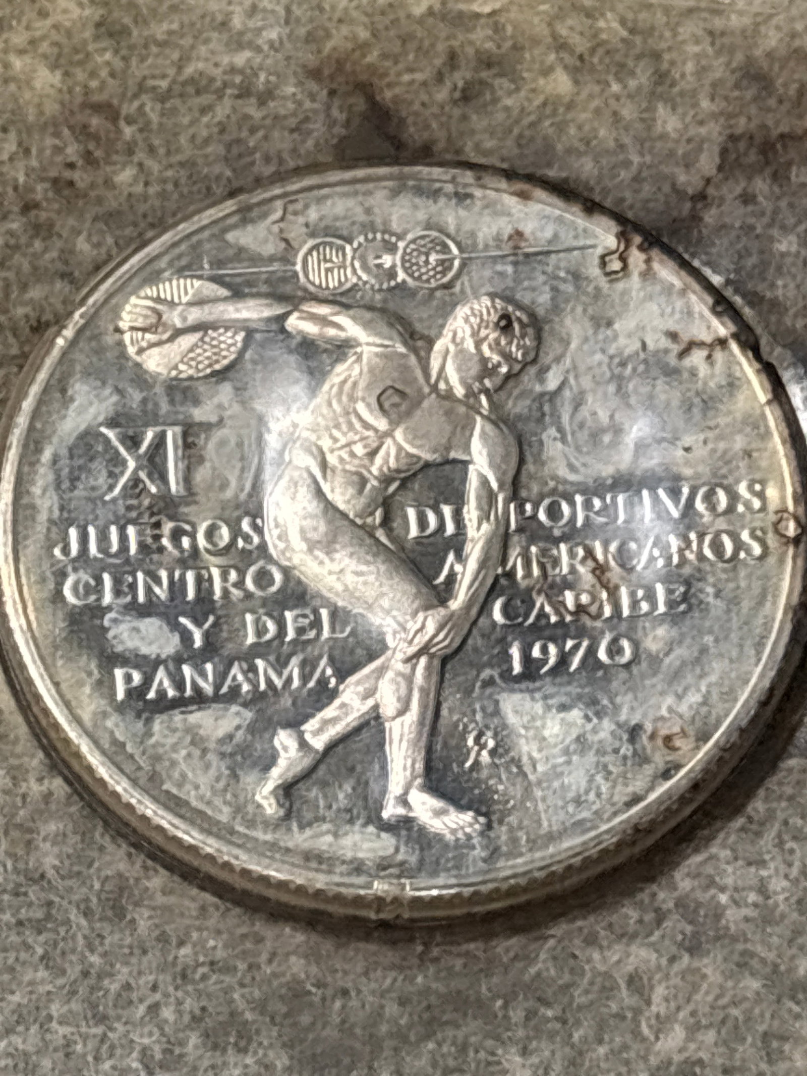 1.06 troy ounce .925 silver 1970 Panama 5 Balboas coin: 1970 Panama 5 Balboas silver coin, minted to commemorate the XI Central American and Caribbean Games. Subject: Depicts a Greek-style discus thrower.Metal Content: Sterling silver (0.925