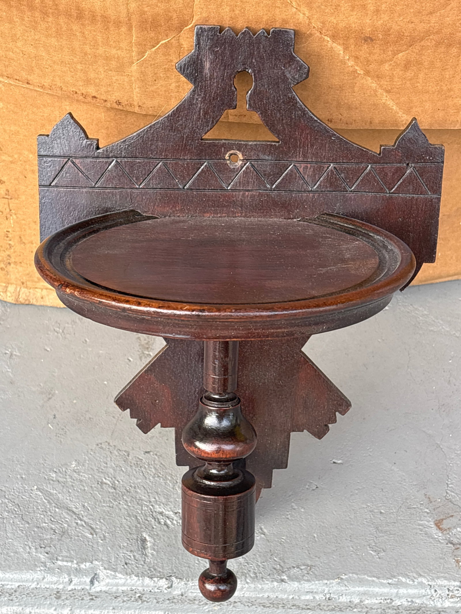 antique walnut Victorian or Eastlake style wall shelf: antique Victorian or Eastlake style wall shelf, likely dating back to the late 19th century. Design: It features hand-carved wood details, often in walnut, and may have been designed to display a cloc