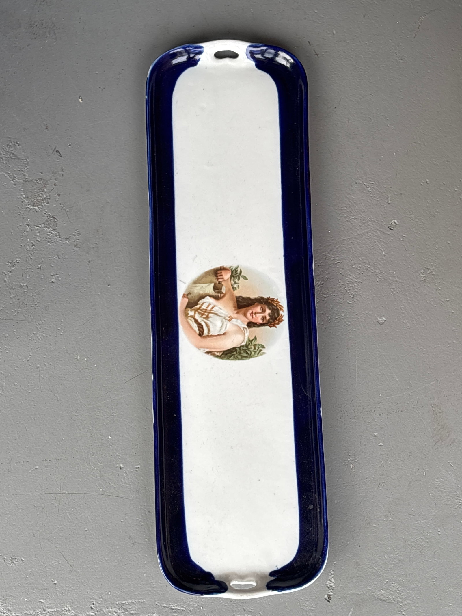 Wide 21inch antique Bavarian portrait tray featuring a transferware image of a Greek goddess: antique Bavarian portrait tray featuring a transferware image of a Greek goddess. It has a white center and a deep cobalt blue border. The tray is elongated, often used as a vanity or trinket tray. Su