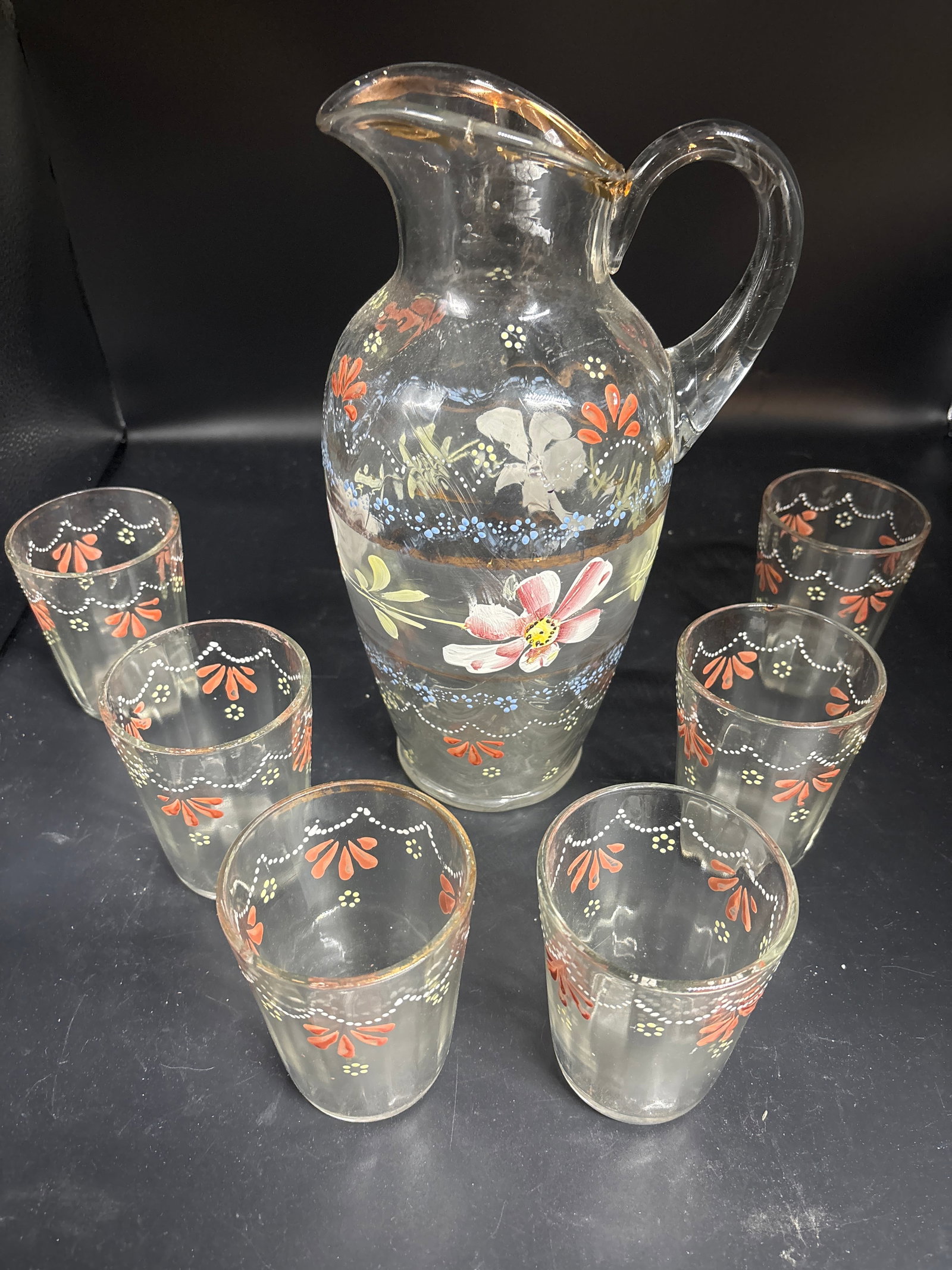 Seven piece Victorian hand painted art glass lemonade pitcher & glasses: vintage Victorian-era lemonade set, typically consisting of a mold-blown pitcher and matching tumblers. These sets were common in the late 19th and early 20th centuries, often featuring hand-painted f