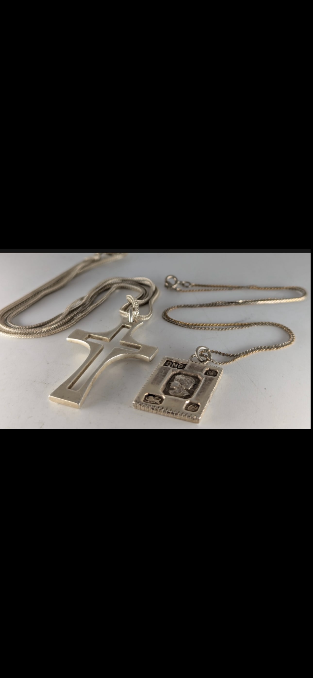 Two English sterling silver Necklaces; Celtic cross & an ingot; 35.3 grams: A silver Celtic cross pendant and chain; a silver ingot and chain, 35.3g (2)