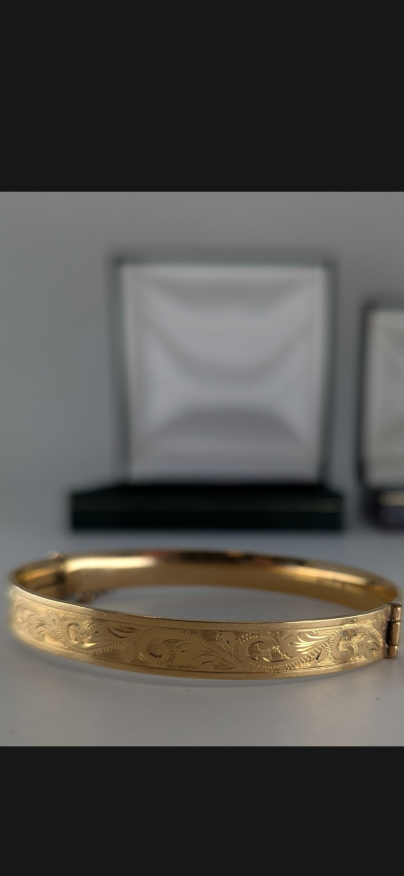 9ct gold and metal core H G & S hinge bangle, 17.5g gross: 9ct gold and metal core H G & S hinge bangle, 17.5g gross With box.