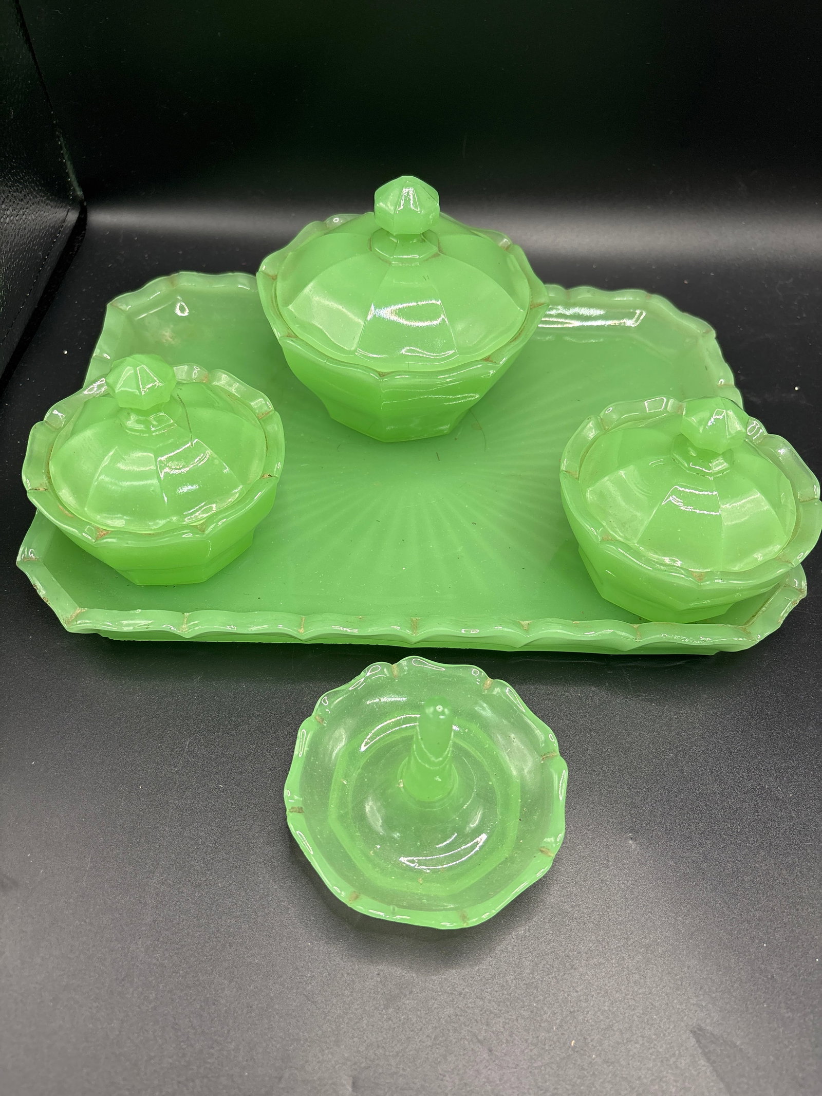 Eight piece uranium green glass vintage Art Deco dressing table vanity set: vintage Art Deco uranium green glass dressing table vanity set, possibly the 'Whitby' pattern produced by Bagley & Co. around 1935. Material: The set is made of glass containing a small amount of uran