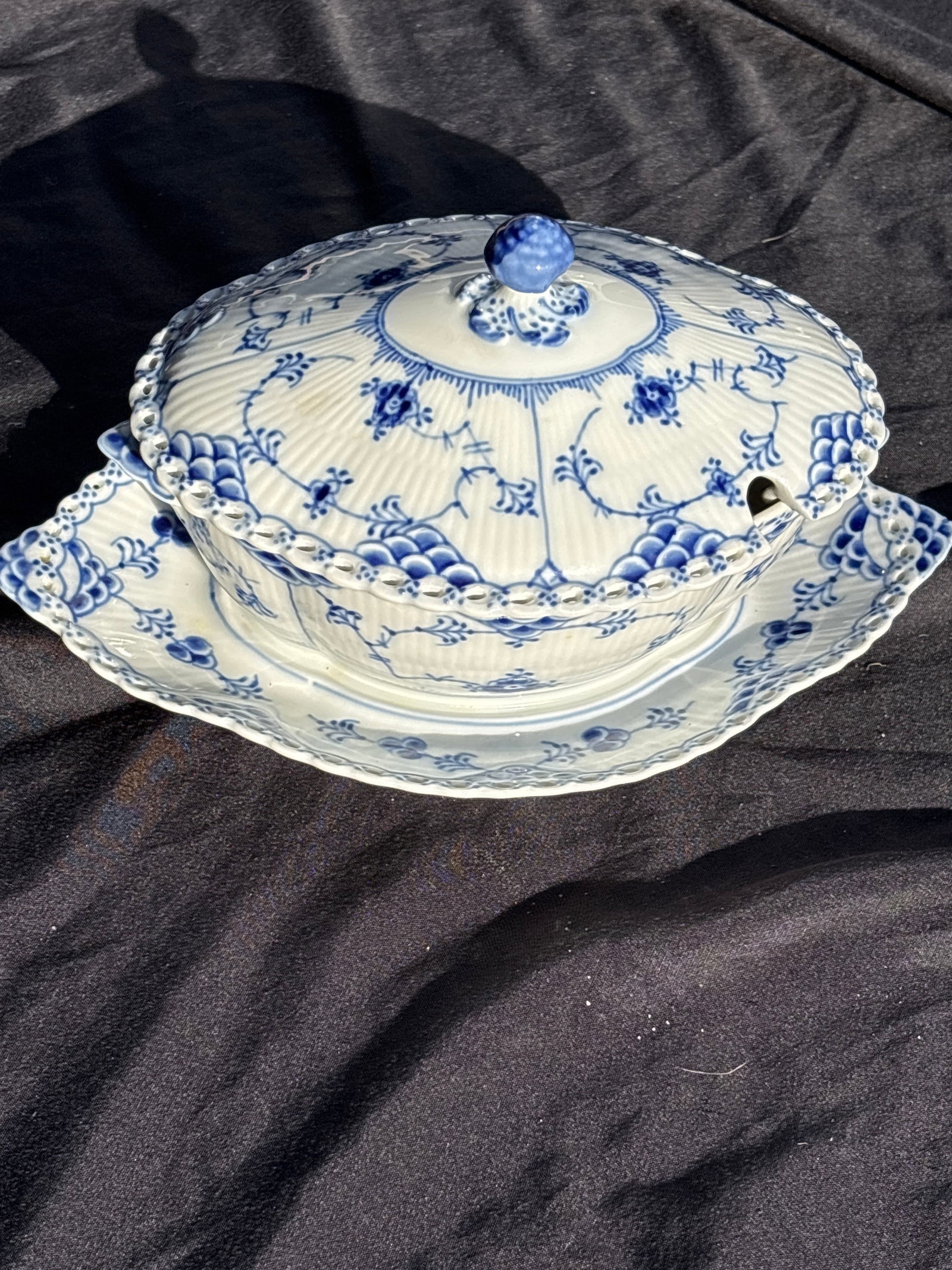 9 inch Covered gravy w/attached under plate Royal Copenhagen Blue Fluted Full Lace #1106: 9 inch Covered gravy w/attached under plate Royal Copenhagen Blue Fluted Full lace salt & pepper shakers number 711& 712…a prestigious line of Danish porcelain.Key FeaturesIntricate lace-like rim wi