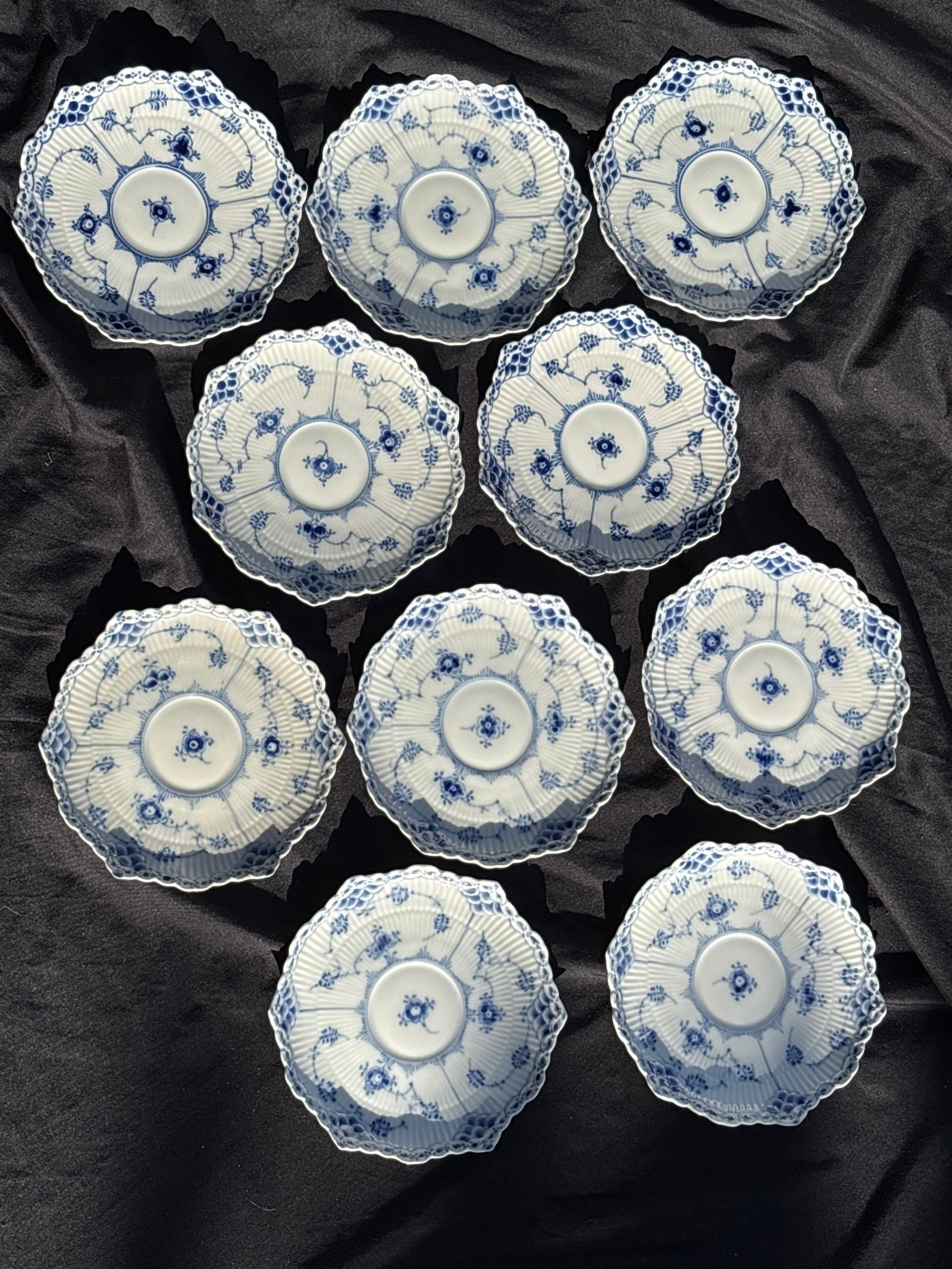 Set of ten 6 inch plates/saucers Royal Copenhagen Blue Fluted Full Lace #1130: Set of ten 6 inch plates/ Royal Copenhagen Blue Fluted Full lace 1130a prestigious line of Danish porcelain.Key FeaturesIntricate lace-like rim with delicate perforations.Hand-painted cobalt blue flor