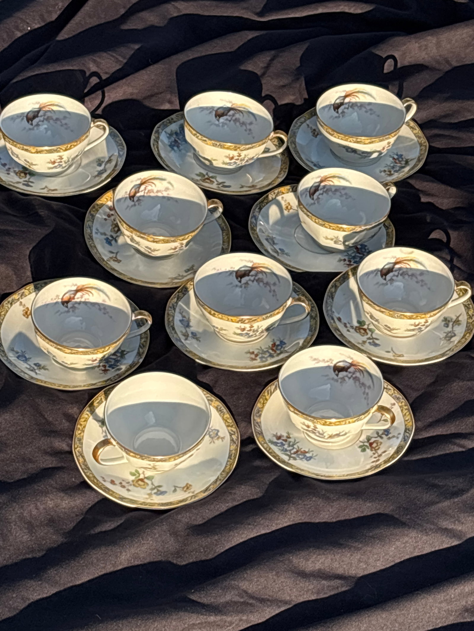 Set of ten 3&1/2 inch Theodore Haviland Limoges ‘Bamboo’ cups with saucers: Set of ten 3&1/2 inch plates Theodore Haviland Limoges cups with saucers in the Bamboo pattern featuring a centered bird of paradise design and a yellow banded rim.Pattern Details: The pattern is know