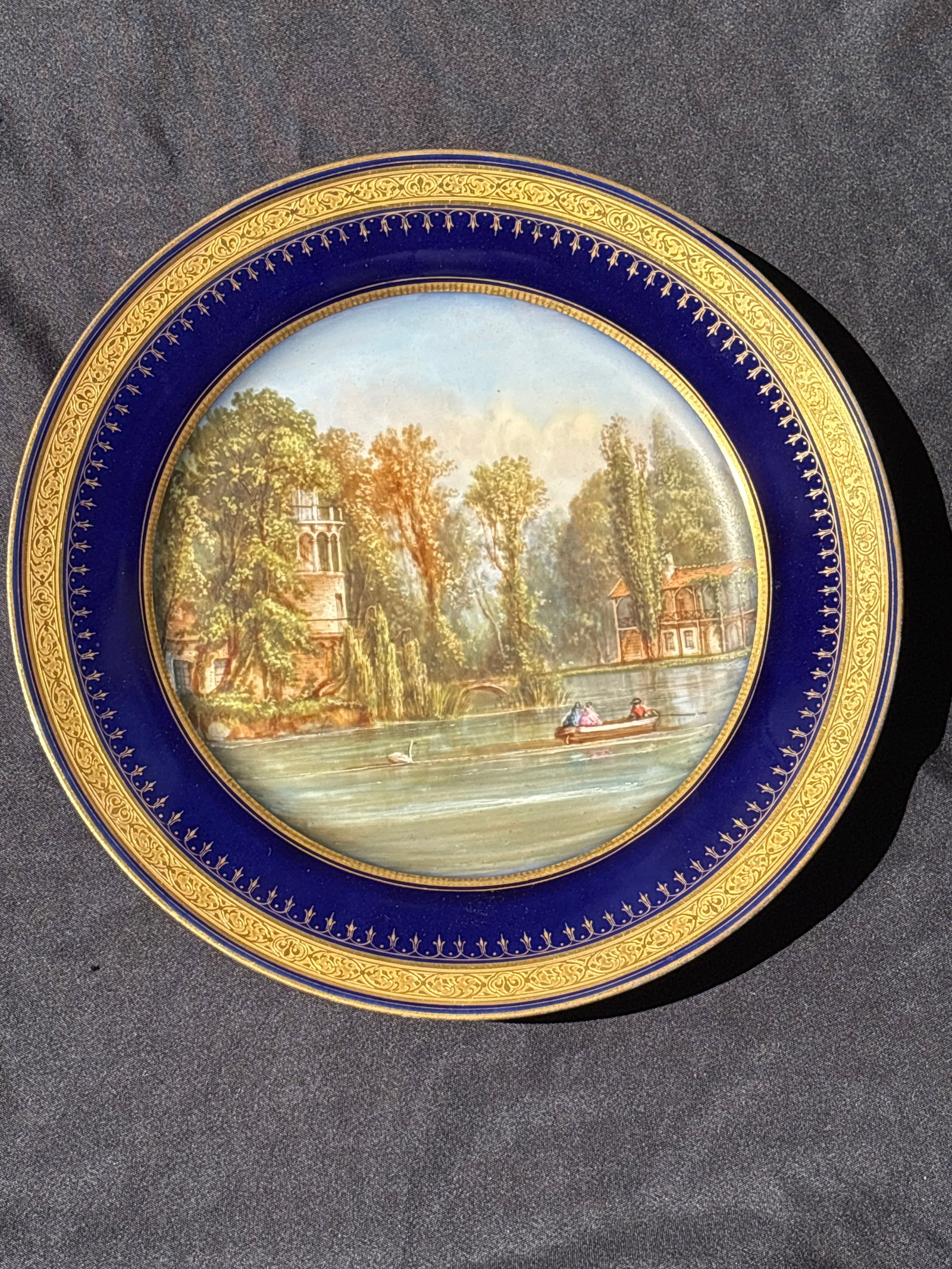 antique French porcelain 8&5/8inch painted cabinet plate ‘Tour de Marlborough‘: antique French porcelain 8&5/8 inch cabinet plate ‘Tour de Marlborough’likely from the early 19th century, featuring hand-painted scenic landscapes surrounded by cobalt blue borders and elaborate 