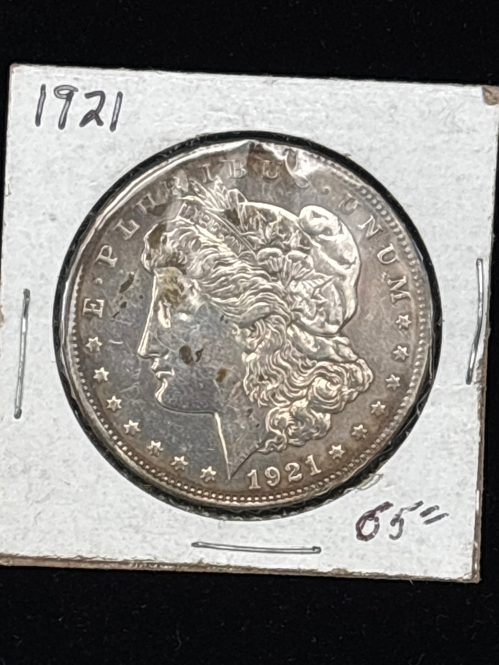 1921 United States Morgan Silver Dollar: 1921 United States Morgan Silver Dollar.The obverse (front) depicts a profile portrait of Lady Liberty, designed by George T. Morgan.It is the final year of production for the classic Morgan dollar se