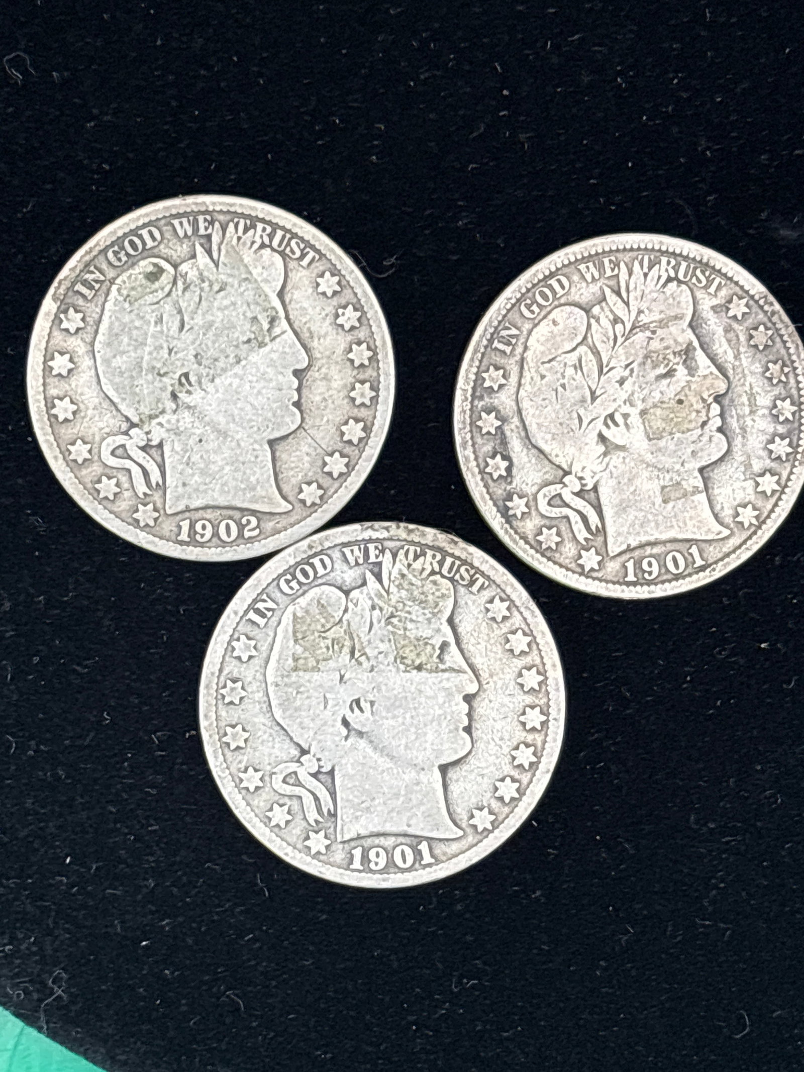 Three silver Barber half dollars.1921 & 1922: Three United States Barber Half Dollar, a 90% silver coin featuring the Liberty Head design.Design: The obverse depicts Liberty wearing a laurel wreath and a Phrygian cap.Composition: These coins cont