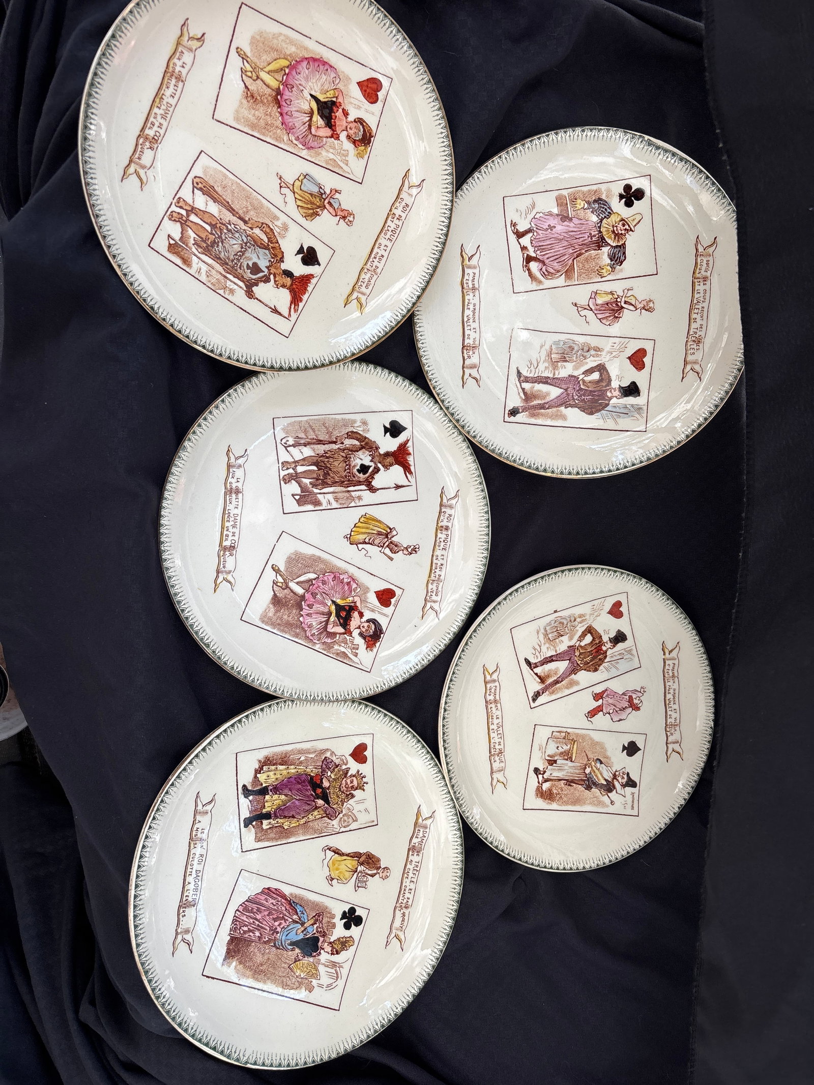 Set of five vintage 7&3/4 inch French "assiettes parlantes" or talking plates: Set of five vintage French "assiettes parlantes" or talking plates, featuring playing card illustrations from the late 19th century.Manufacturer: Produced by the French factory Choisy-le-Roi, specific