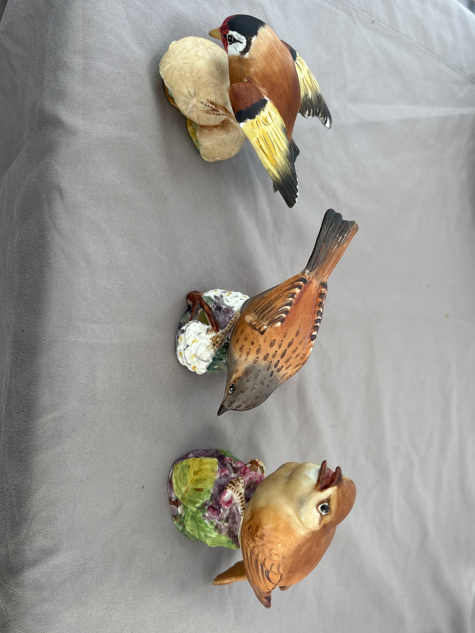 Three Royal Worcester bone china Goldfinch, Hedge Sparrow & Nightingale: Three Royal Worcester bone china figurines; Goldfinch, Hedge Sparrow & Nightingale; identified as model number 3239, 333& 3337. . Produced in England during the mid-20th century, this piece is part of
