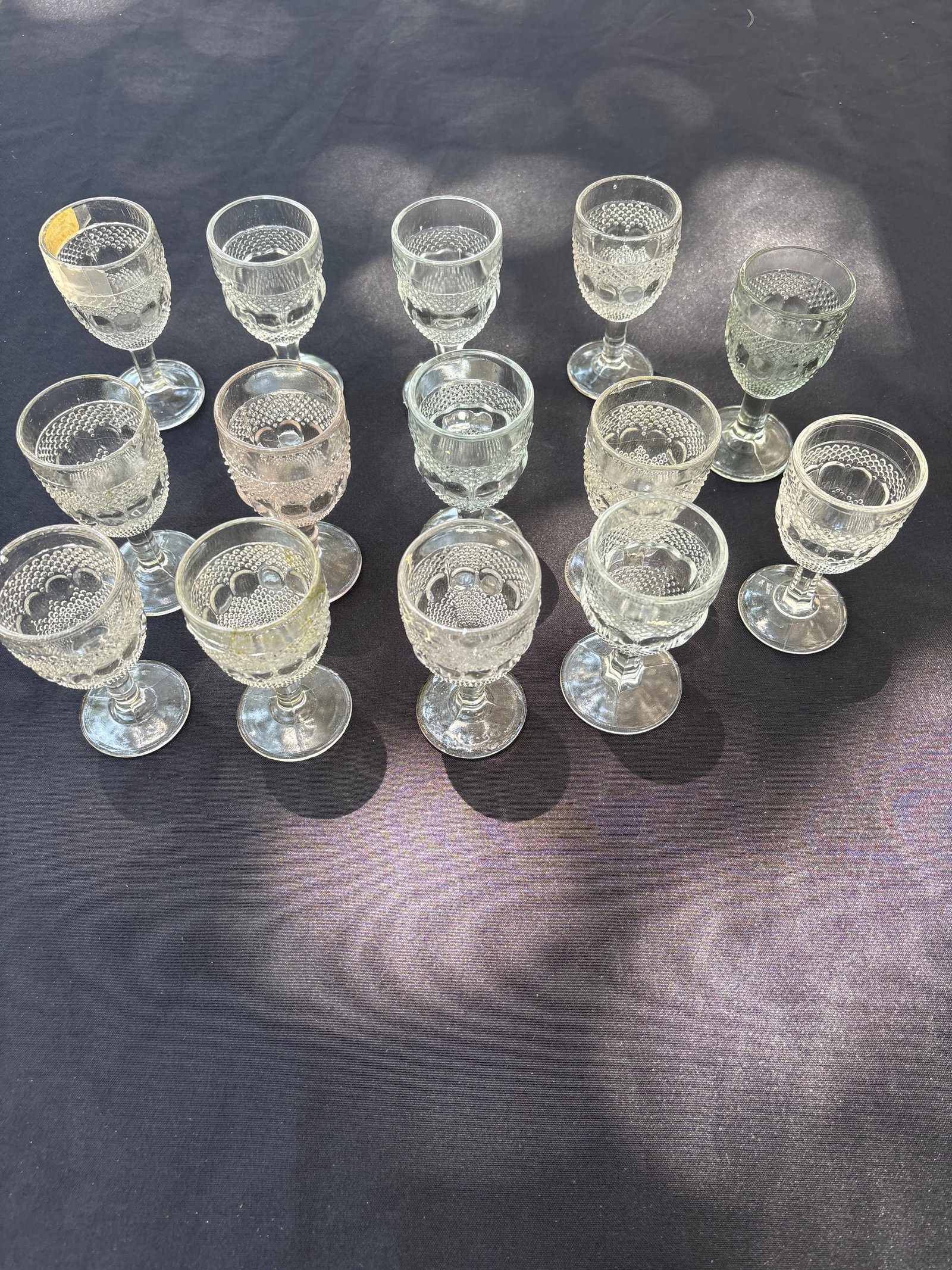 Fourteen antique glasses; possibly Kokomo Glass Works Dewdrop and Raindrop cordials (1 of 6)
