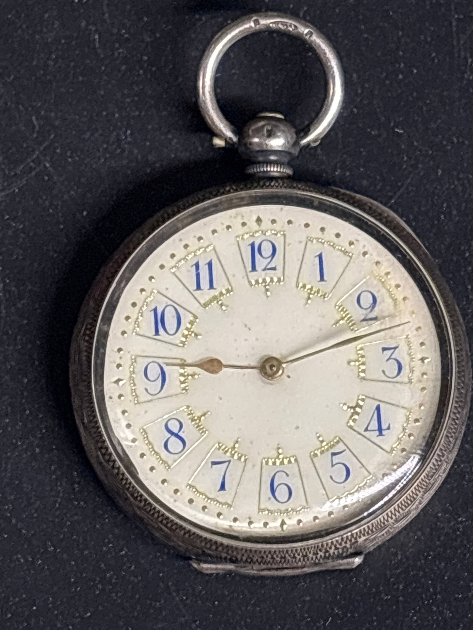antique .935 silver Victorian-era fob pocket watch’Rock bottom’ white enamel dial,blue numbers: antique Victorian-era fob pocket watch featuring a white enamel dial with blue numerals. The watch has a silver case, often hallmark-referenced as 0.935 or sterling silver. These timepieces often cont