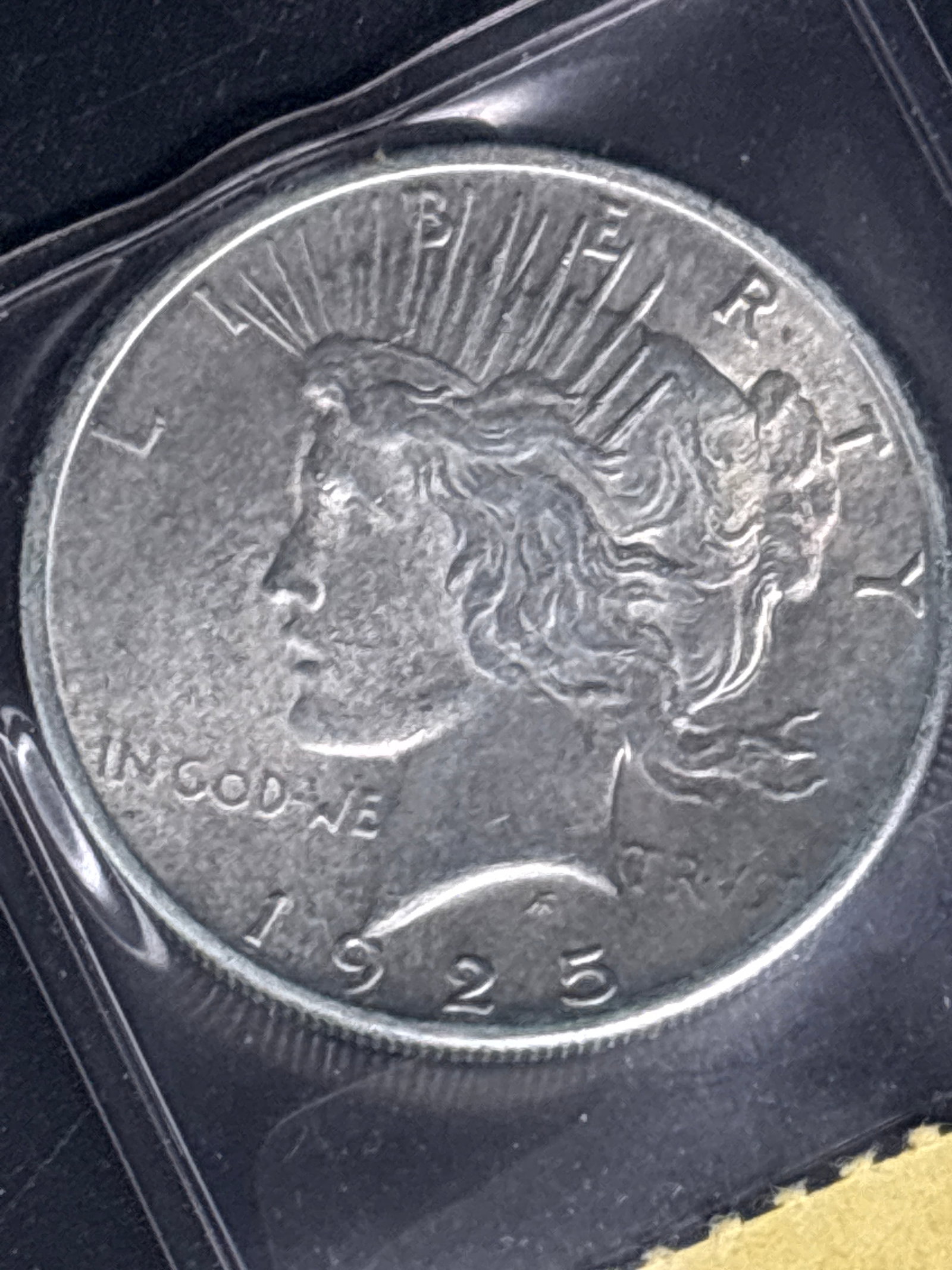Authentic 1925 Peace United States Morgan Silver Dollar.: Authentic 1925 Peace Silver Dollar.Composition: It is made of 90% silver and 10% copper.Design: The obverse features the profile of Lady Liberty with a radiant crown, designed by Anthony de Francisci.