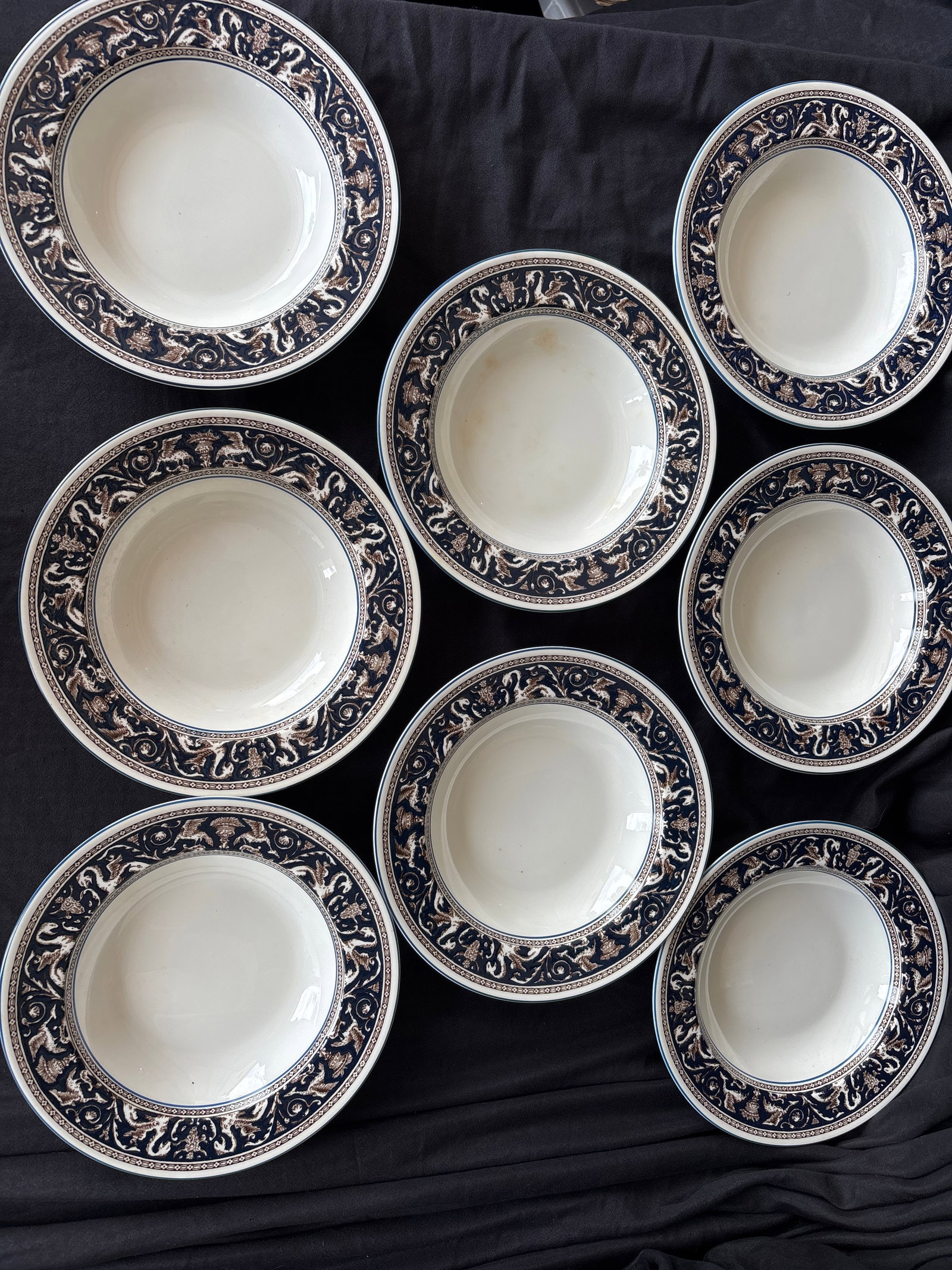 Set eight 8&1/2 inch rimmed soup bowls Wedgwood Florentine Dark Blue (W1956): Wedgwood Florentine Dark Blue (W1956) pattern. This classic design is crafted from fine bone china and features a rich cobalt/navy blue rim decorated with mythological dragons and phoenixes.The patter