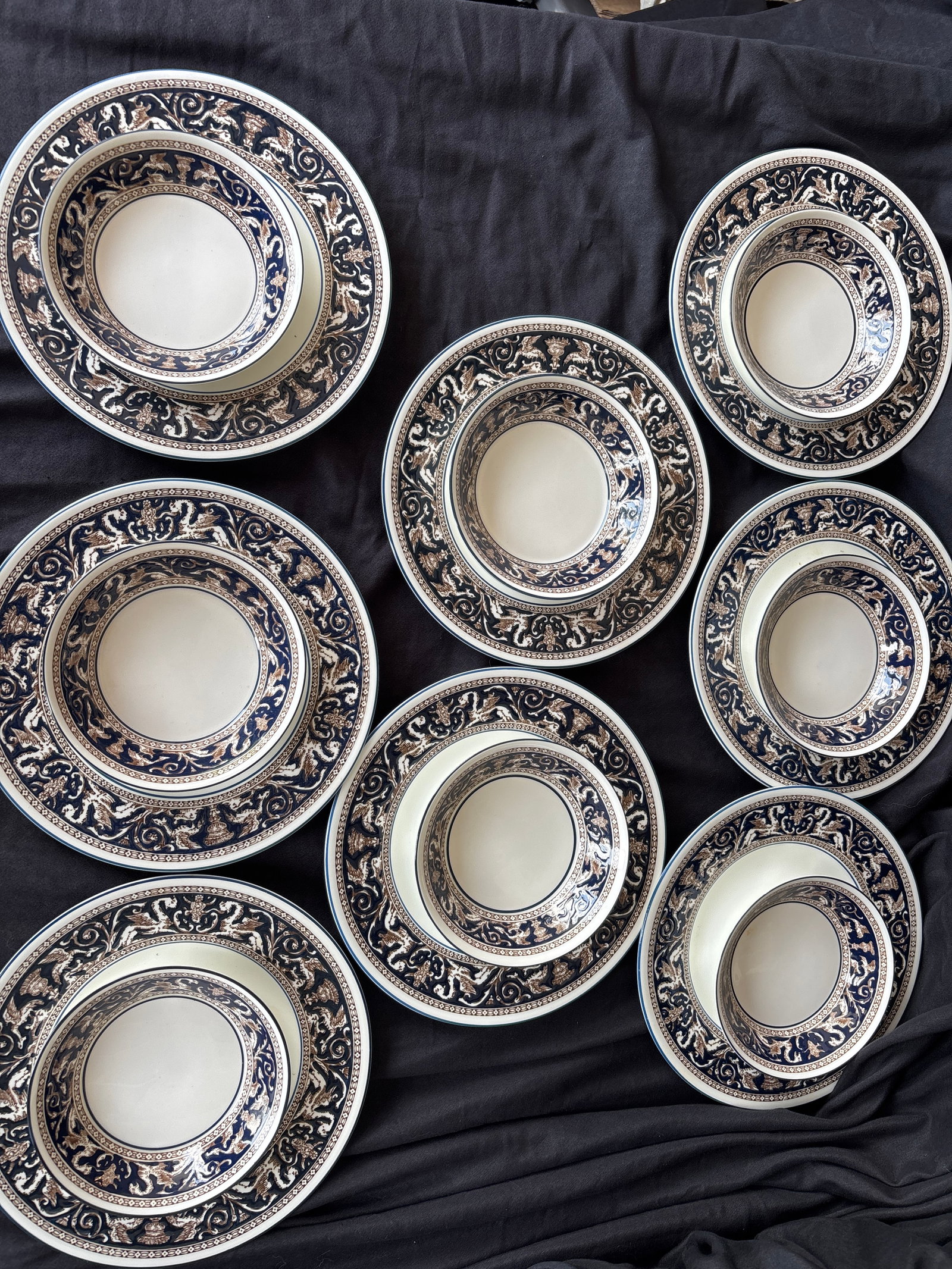 Two Sets of eight plates & bowls Wedgwood Florentine Dark Blue (W1956): sixteen piece; two sets eight 8&1/4 inch plates & 5 inch side bowls; Wedgwood Florentine Dark Blue (W1956) pattern. This classic design is crafted from fine bone china and features a rich cobalt/navy 
