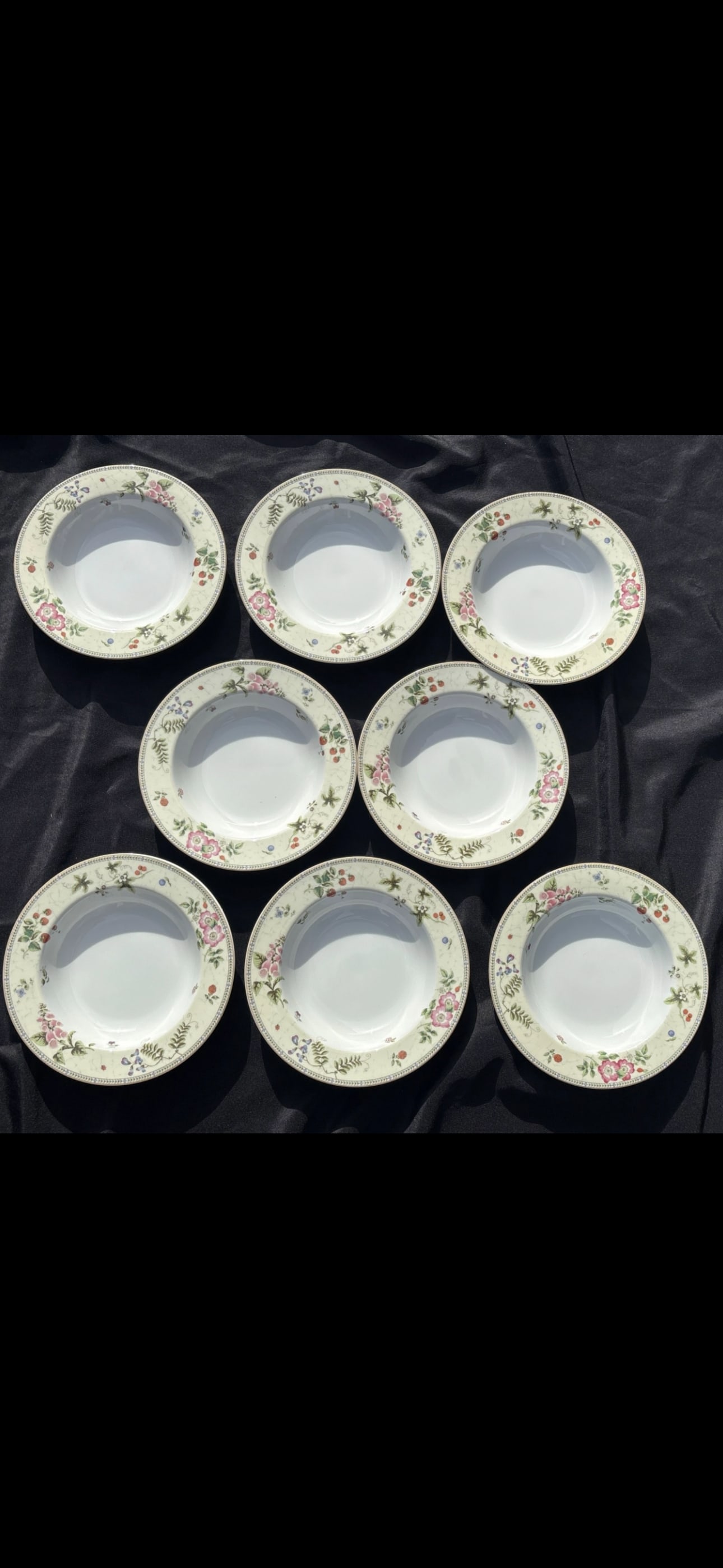 Set of eight 9 inch rimmed bowls Wedgwood Fleur pattern: Set of eight 9 inch rimmed bowls Wedgwood the Fleur pattern.Pattern DetailsThe Fleur pattern features a delicate design of pink and white flowers along with various fruits, including strawberries on v