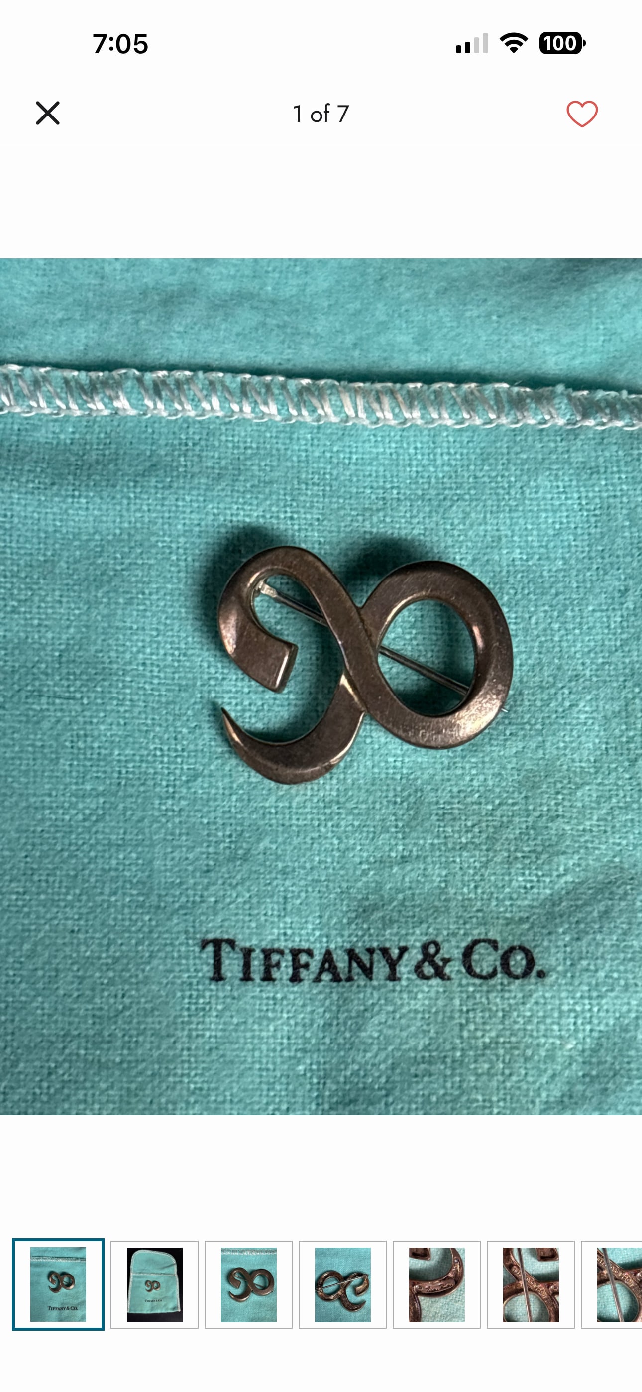 Tiffany & Co. .925 sterling silver ampersand-shaped 1 inch brooch: Tiffany & Co. .925 sterling silver ampersand-shaped brooch, which is a symbol used in their branding.While it shares the fluid, sculptural quality of several Tiffany collections, similar pieces includ