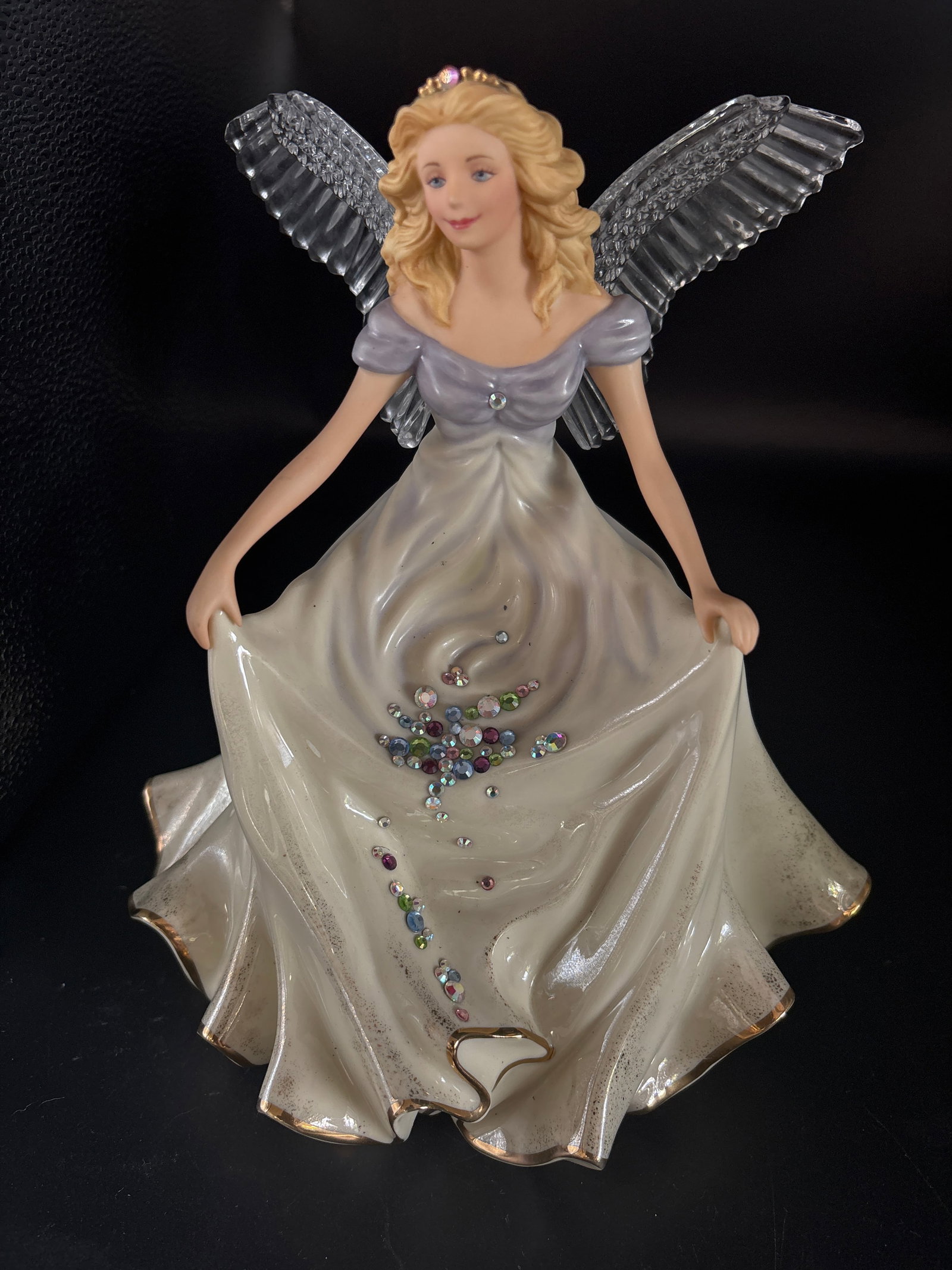 Lenox ‘Jewels from Heaven’ angel figurine featuring lead crystal wings & 24 k gold accents: Lenox "Jewels from Heaven" angel figurine featuring lead crystal wings and 24-karat gold accents.Brand: Lenox, specifically from the Crystal Accent Angel Collection.Material: Crafted from ivory fine c