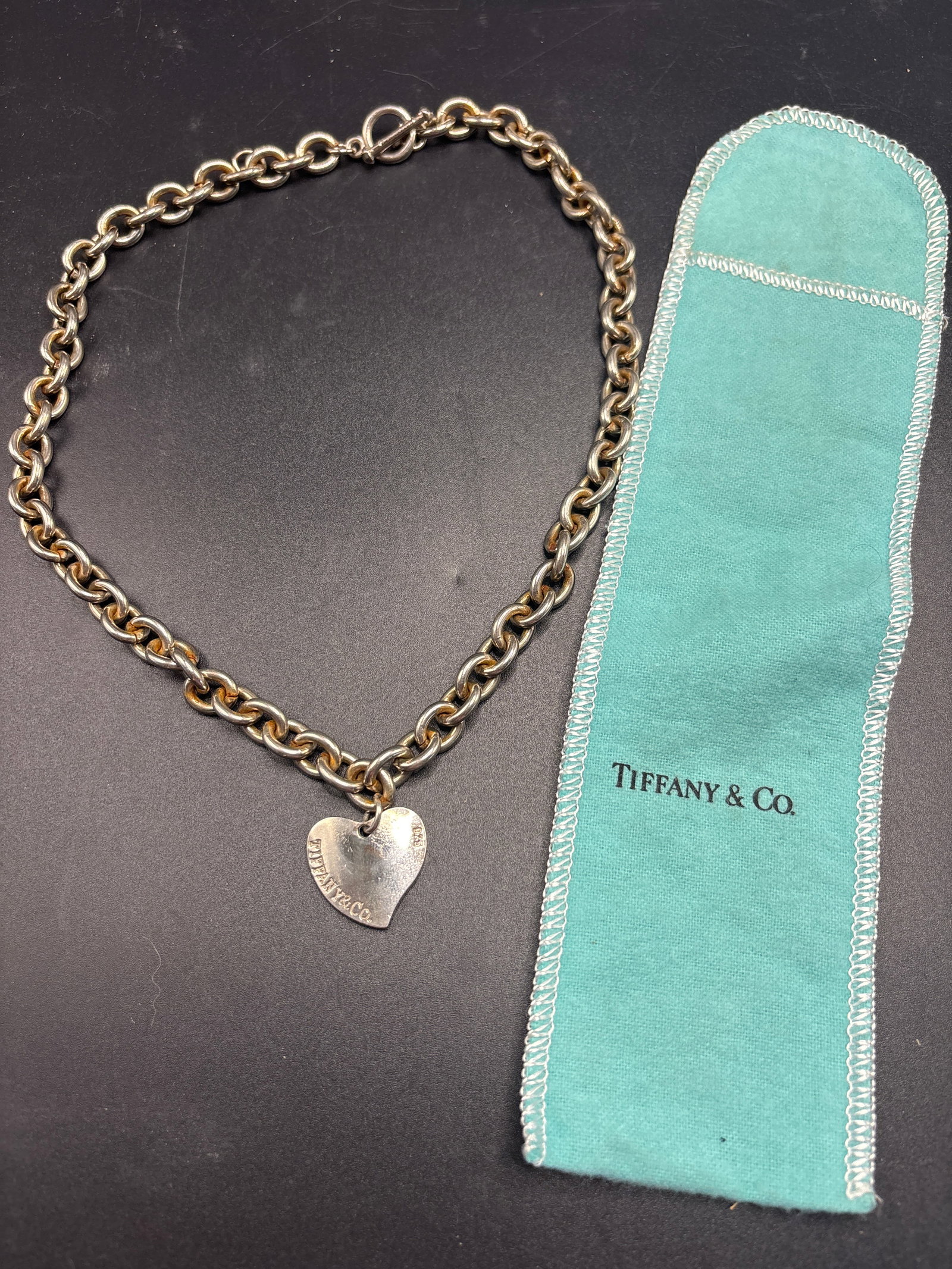 Large Tiffany & Co. sterling silver heart tag necklace ; 67 grams.: Tiffany & Co. Return to Tiffany® heart tag necklace is crafted from sterling silver.It features a distinctive heart-shaped tag charm on a chain link necklace.The design is often completed with a togg