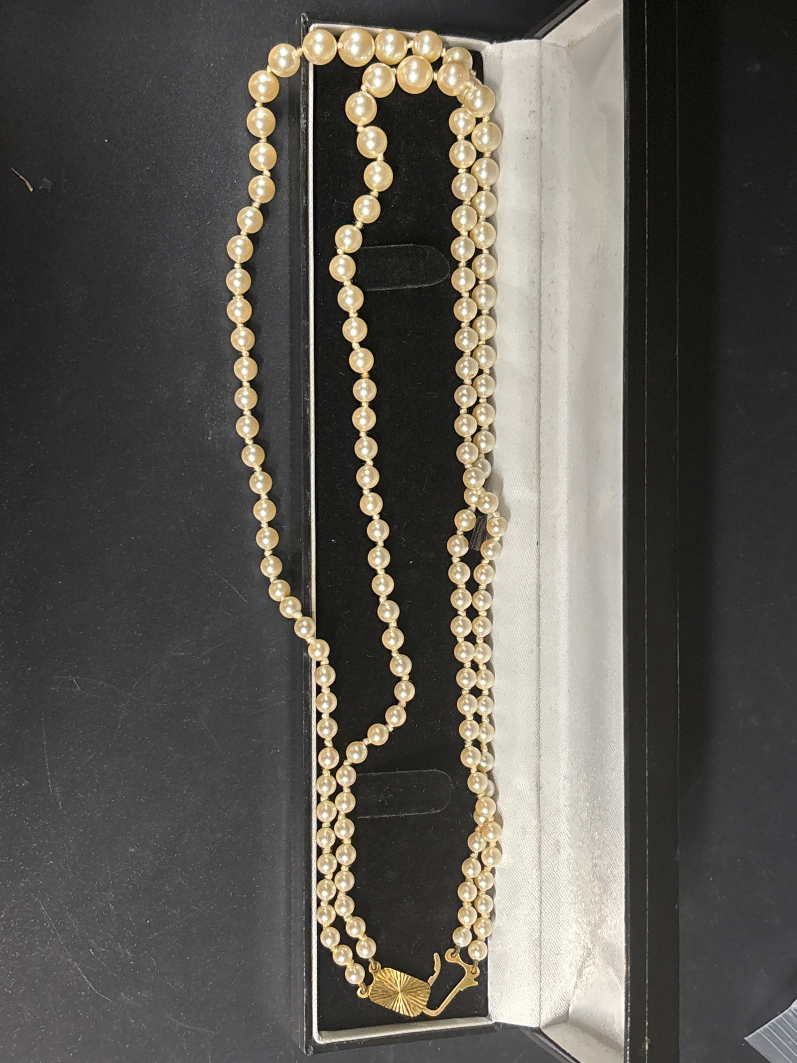 Vintage English 9ct yellow gold clasp double-strand cultured pearl necklace: double-strand cultured pearl necklace with a 9-karat (9k / .375) yellow gold clasp arranged in a presentation case.Value and Identification GuideThe overall market value for vintage double-strand