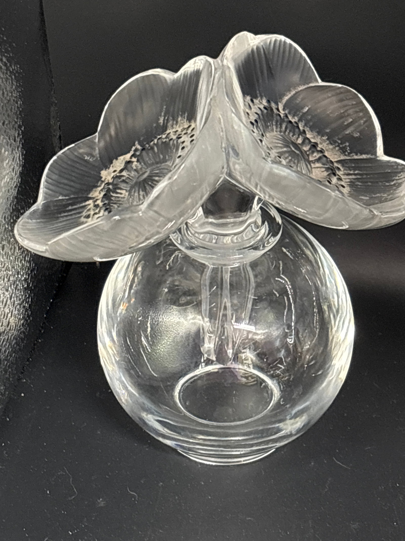 Lalique Crystal "Deux Fleurs" (Two Flowers) or "Deux Anémones" 6.5 inch perfume bottle: Lalique Crystal "Deux Fleurs" (Two Flowers) or "Deux Anémones" perfume bottle.It features a clear glass bulbous body paired with a distinctive stopper sculpted as two frosted crystal anemone blossoms