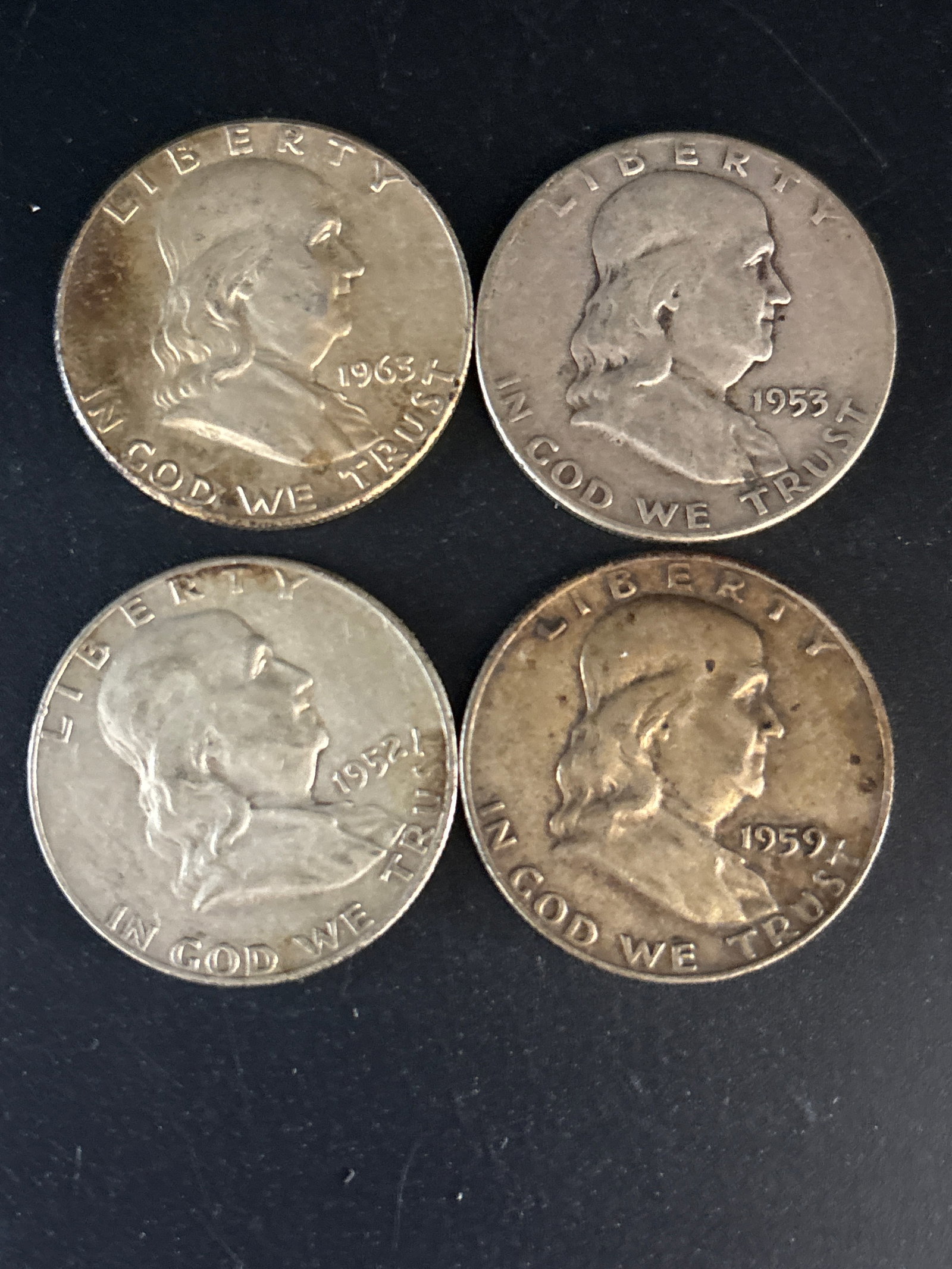 Four 1943 Benjamin Franklin Half Dollar coins (1 of 5)