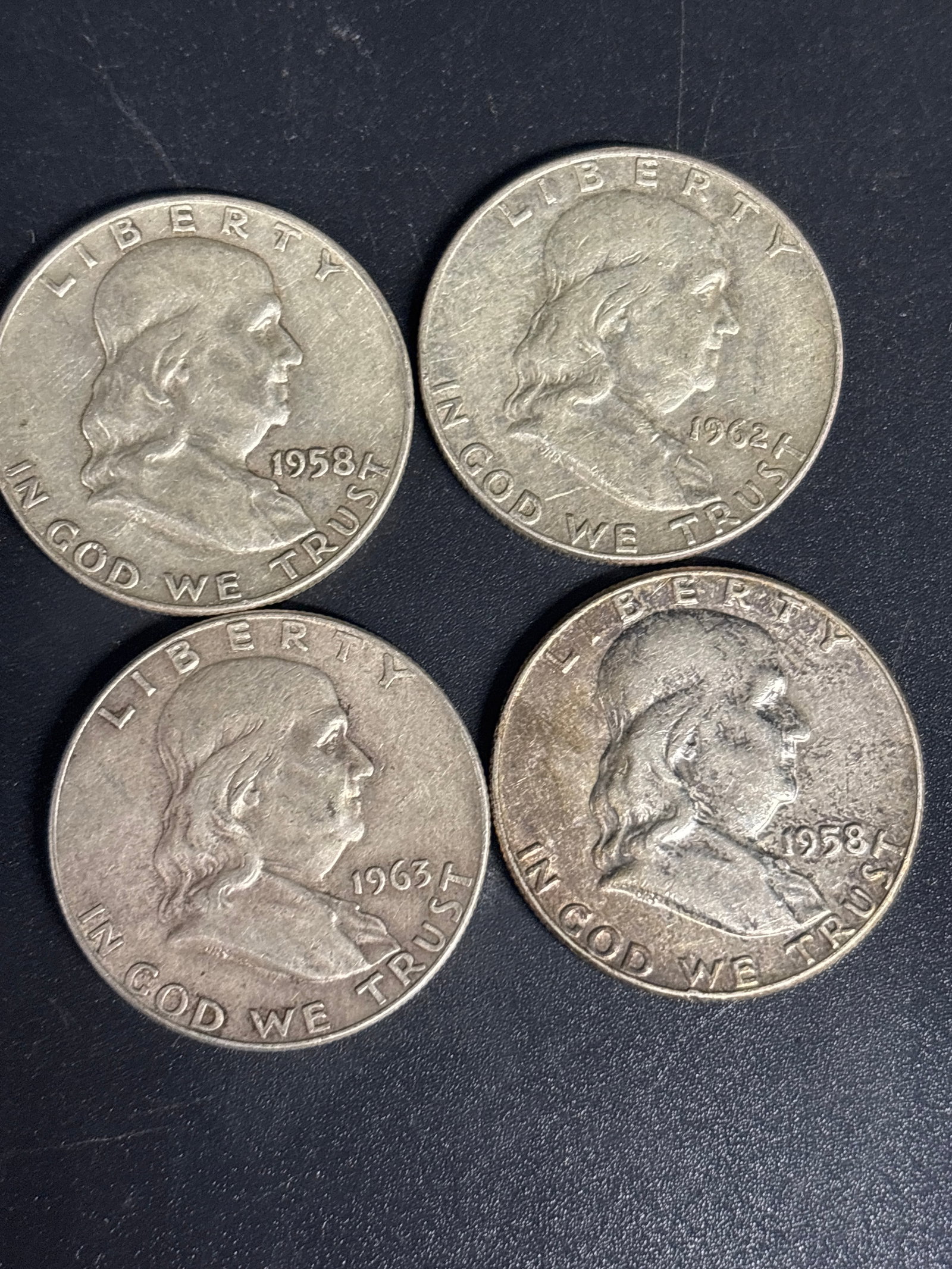 Four Benjamin Franklin Silver half dollars: Four Benjamin Franklin Silver half dollars. Two 1958, a 1962 & a 1963.