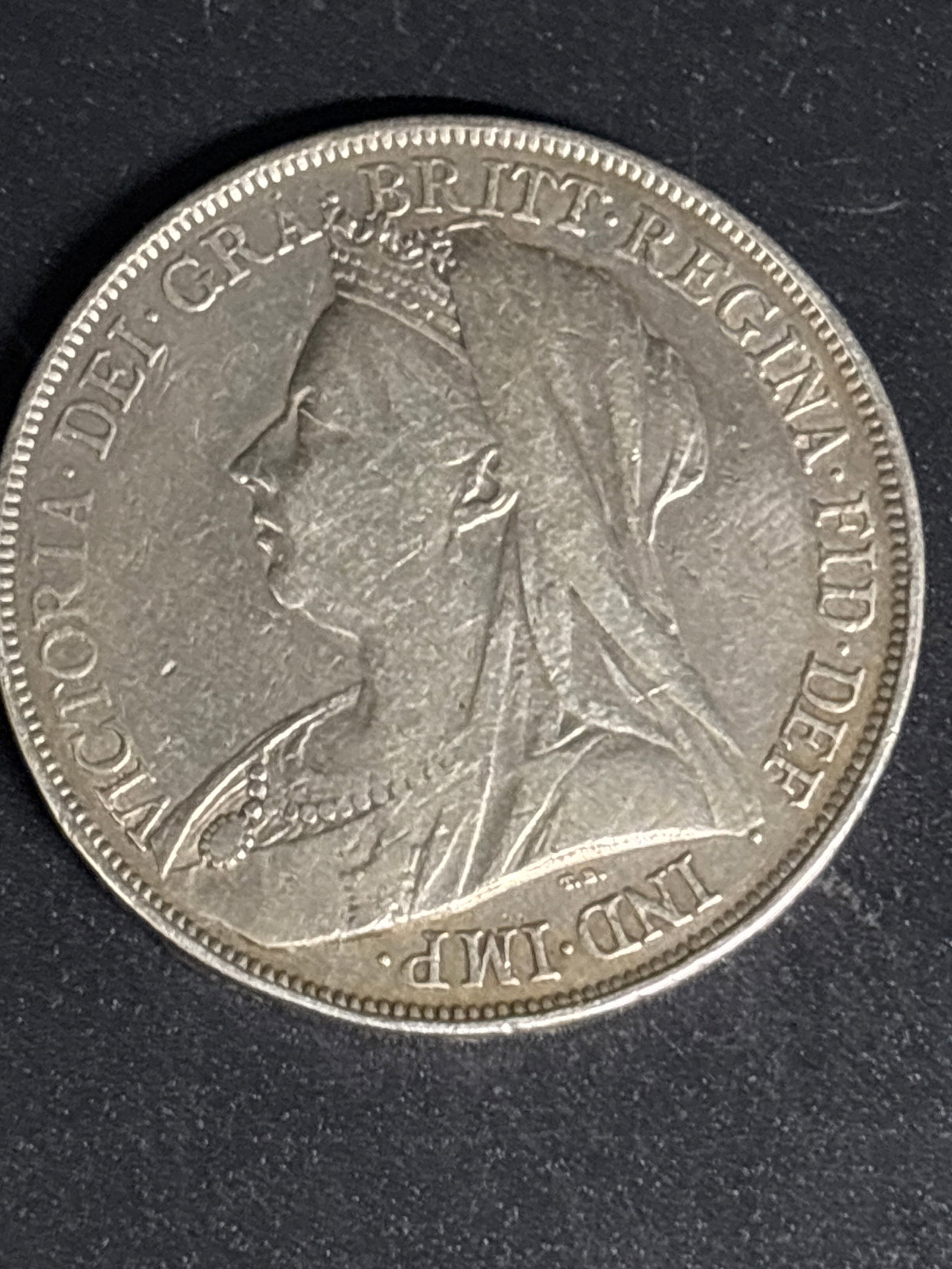 28.28 grams .925 Silver 1900 Queen Victoria era British Silver Crown: British 1900 Silver Crown minted during the reign of Queen Victoria.Key Details & IdentificationReverse Design: Features the iconic depiction of St. George slaying the dragon, designed by Benedetto Pi