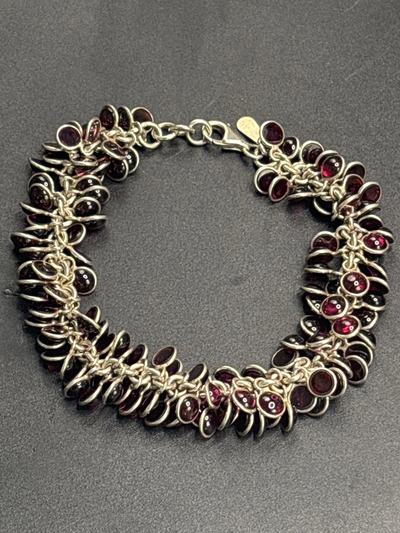 vintage retired Silpada sterling silver garnet cha-cha bracelet: retired Silpada sterling silver garnet cha-cha bracelet featuring dozens of genuine deep-red garnet gemstones.Brand: SilpadaMaterial: .925 Sterling SilverStones: Genuine Red GarnetsStyle: Cha-cha dang
