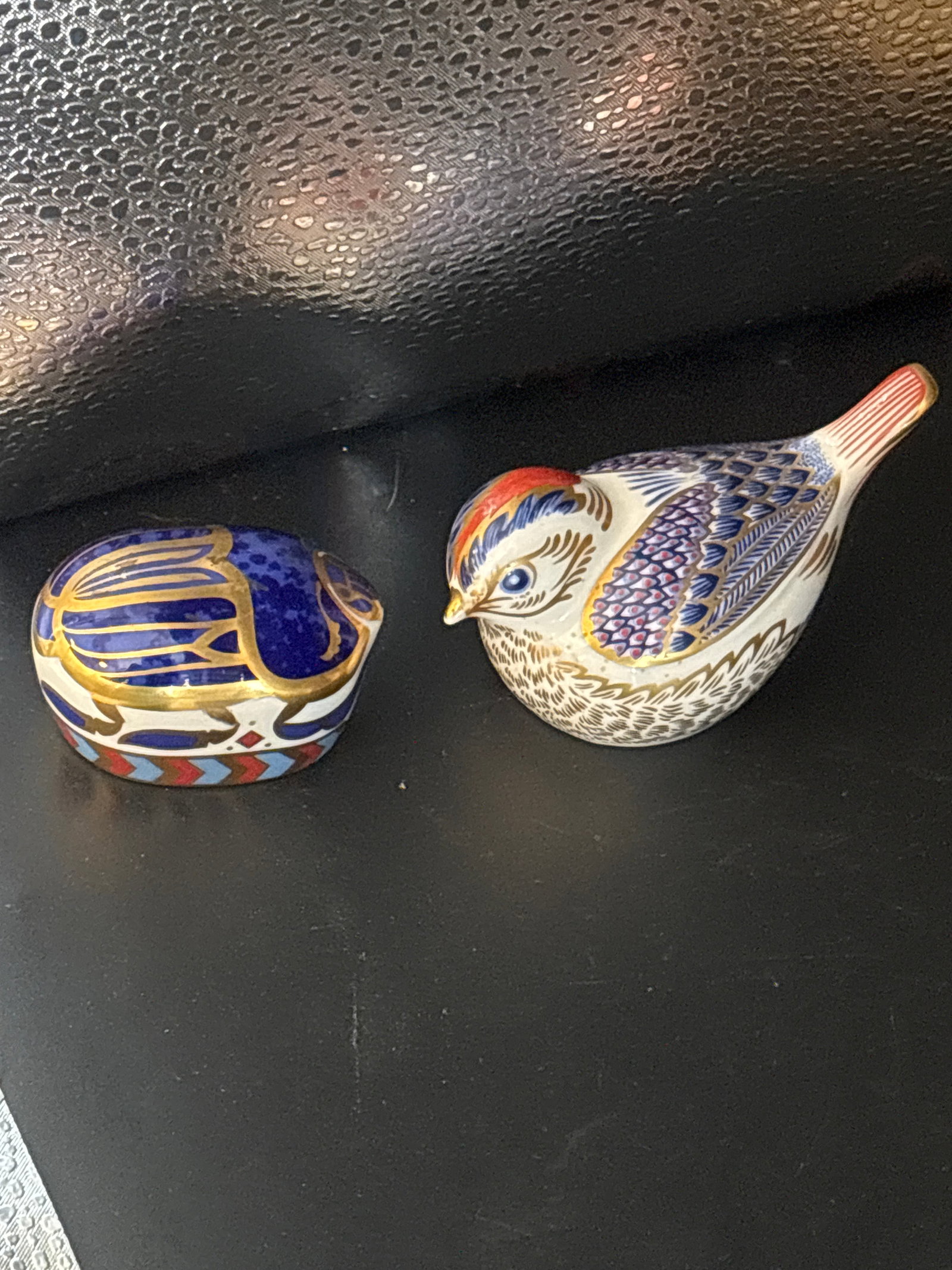 Millinium bug Royal Crown Derby porcelain & bird paperweight: Millinium bug Royal Crown Derby porcelain & bird paperweight, likely a Goldcrest or Firecrest model based on the Imari-style blue and red coloring.These decorative figurines are crafted from English f