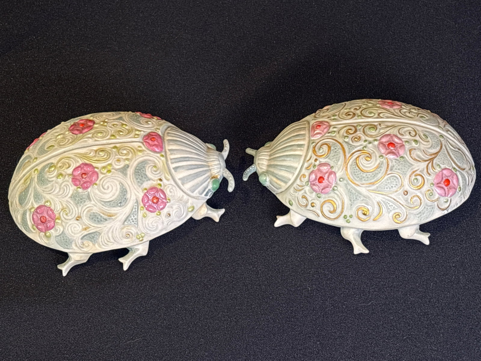 Two rare vintage Cybis Porcelain ladybug figurines titled "Duchess of Seven Rosettes“: Two rare vintage Cybis Porcelain ladybug figurines titled "Duchess of Seven Rosettes," originally issued in 1975.The figures are made of hand-painted bisque porcelain with delicate gold accents and fl