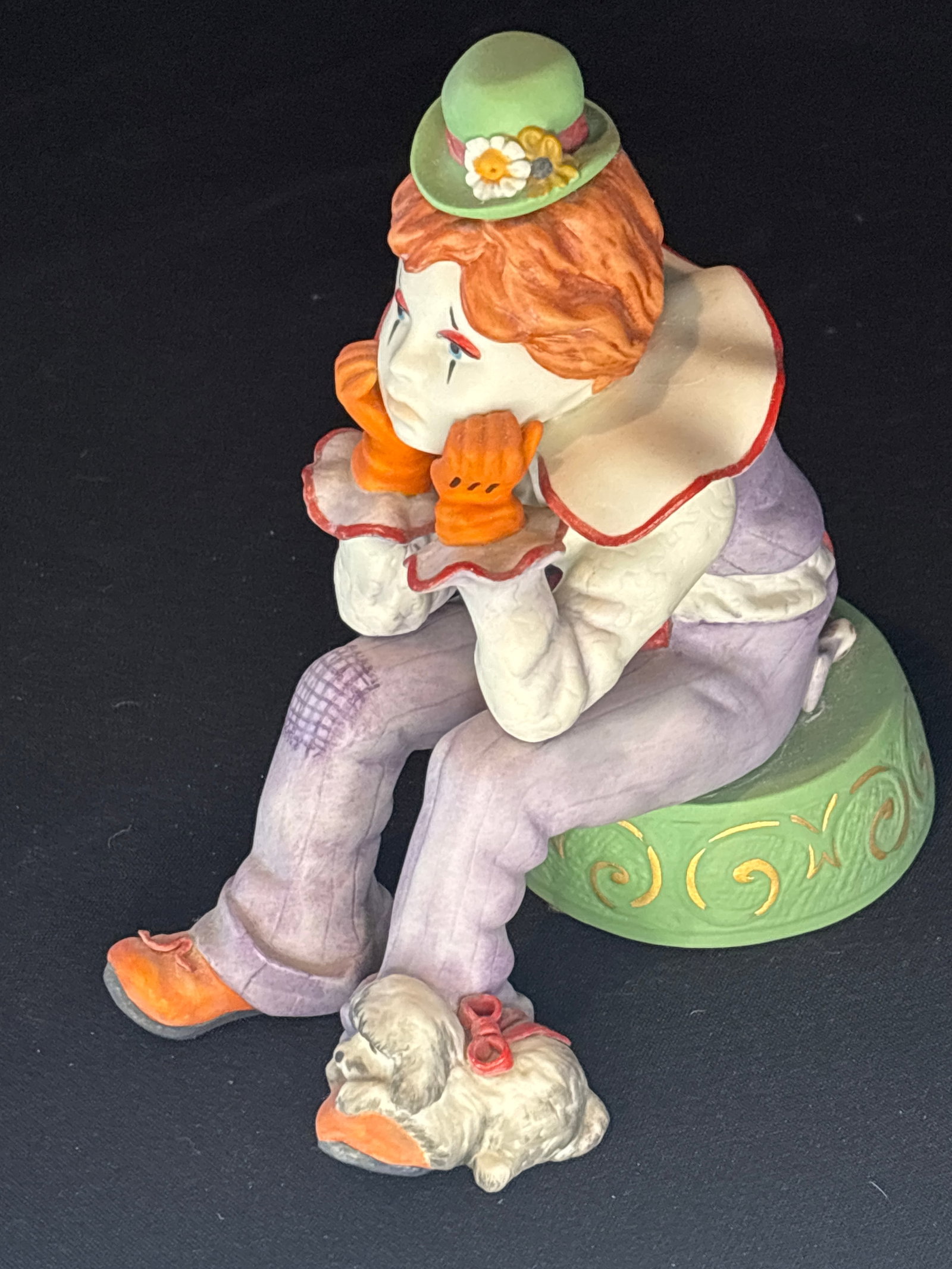 Cybis Rumples the Pensive Clown bisque porcelain figurine sculpted by William Pae: Rumples the Pensive Clown," a vintage bisque porcelain figurine sculpted by William Pae for the Cybis Porcelain studio.Design Details: Introduced in 1979 as part of the "Cybis Goes to the Circus" seri