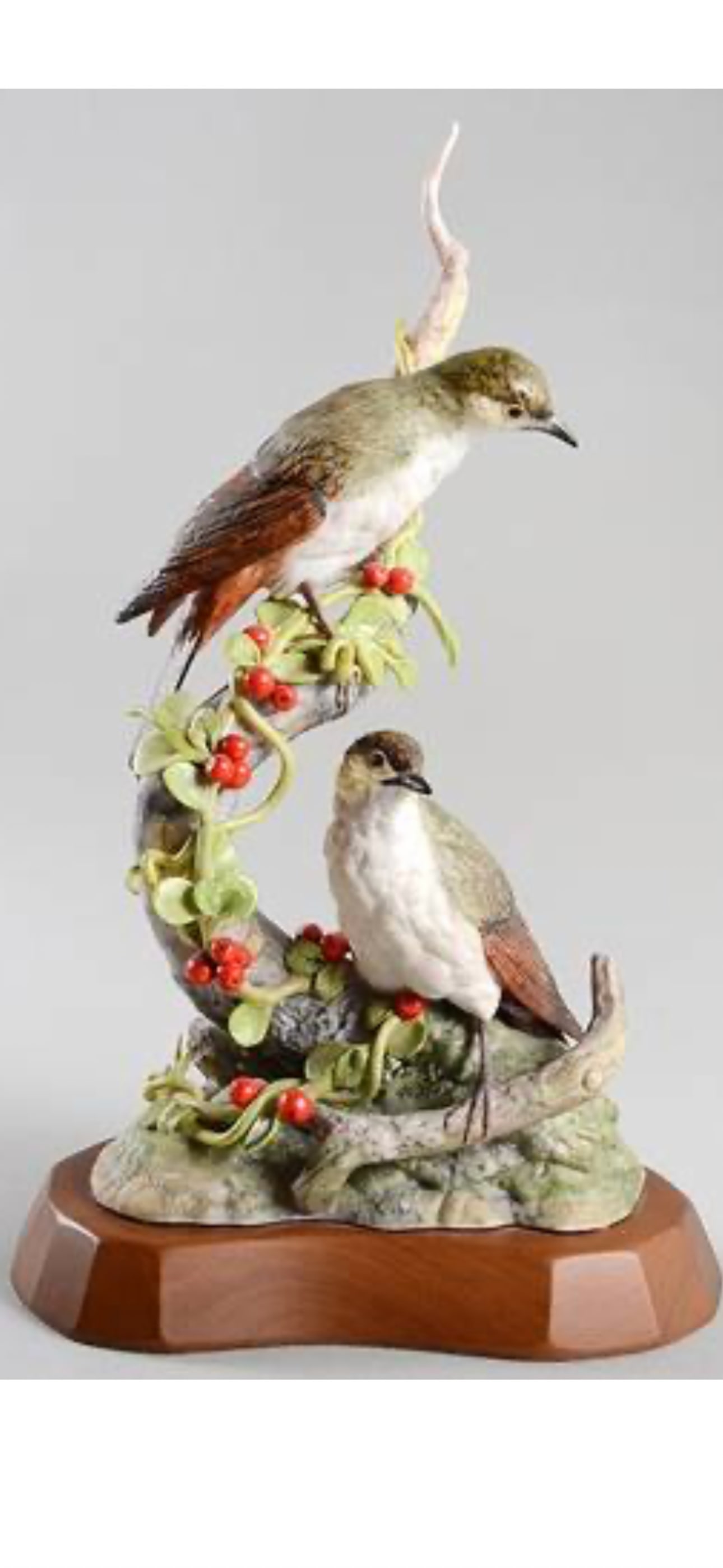 vintage Cybis Bisque Porcelain 15.5 inch Figurine depictingpair of Hermit Thrushes with Cranberry: vintage Cybis Bisque Porcelain Figurine depicting a pair of Hermit Thrushes with Cranberry Cotoneaster.Product DetailsManufacturer: Cybis Porcelain Art StudioSubject: Hermit Thrush (Catharus guttatus)