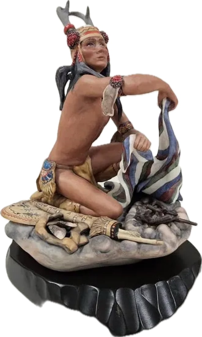Cybis Apache "Chato" porcelain figurine designed by Helen Granger Young: Apache Chato" is a fine bisque porcelain figurine created by the Cybis Porcelain studio and designed by Helen Granger Young. Introduced in 1974 as part of the North American Indians collection, it ori