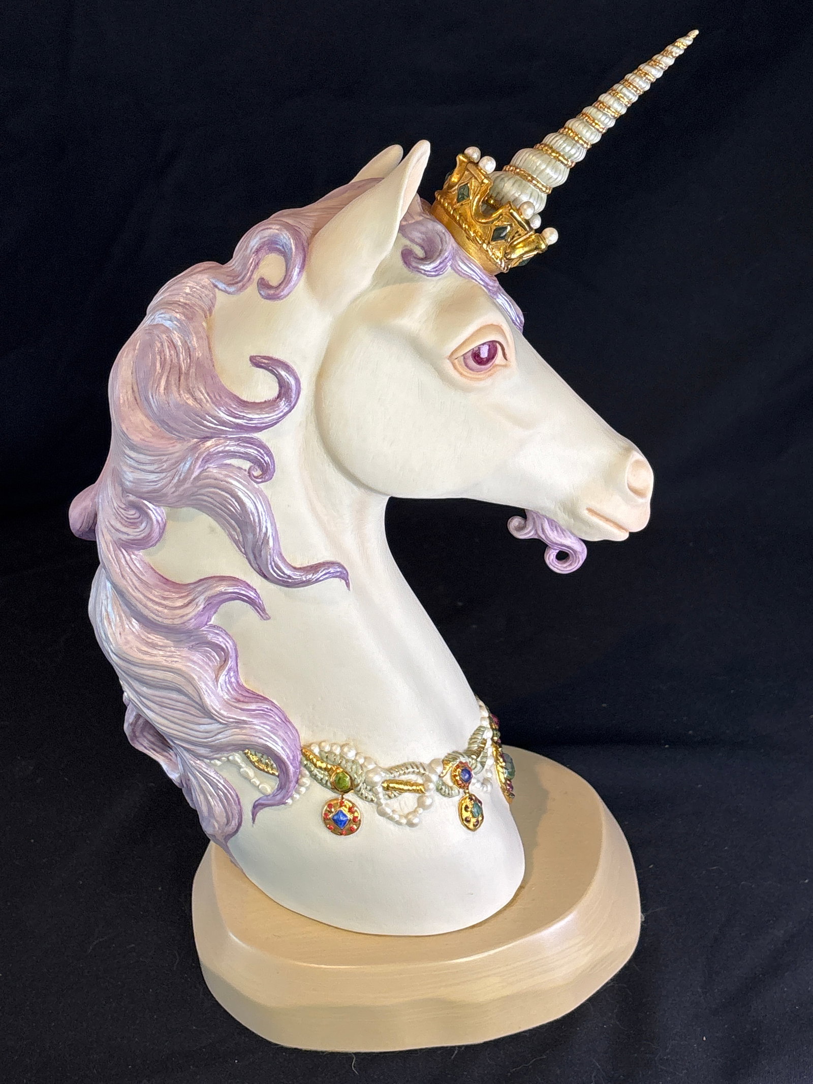 Unusual purple mane Limited edition Cybis Porcelain 'Prince Brocade' unicorn bust: Unusual purple mane "Prince Brocade" Porcelain Unicorn Head Bust, a limited-edition art sculpture manufactured by the renowned American porcelain studio Cybis.Key CharacteristicsDesigner: Formed and d