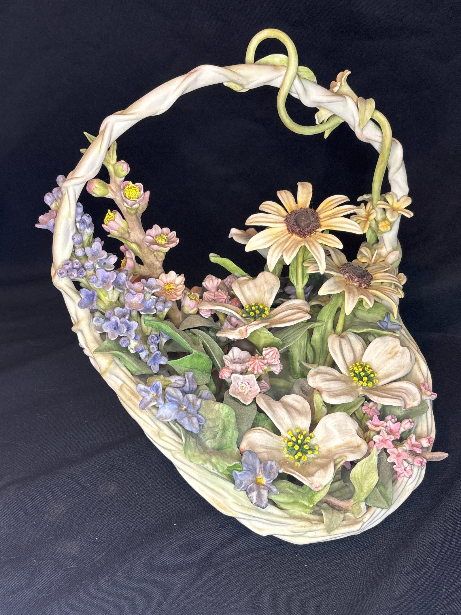 Third offered, Cybis "Colonial Basket", an intricate limited-edition Bicentennial piece: Cybis "Colonial Basket", an intricate limited-edition Bicentennial piece designed by Lynn Klockner Brown featuring hand-formed botanical state flowers representing the original thirteen colonies.Maker
