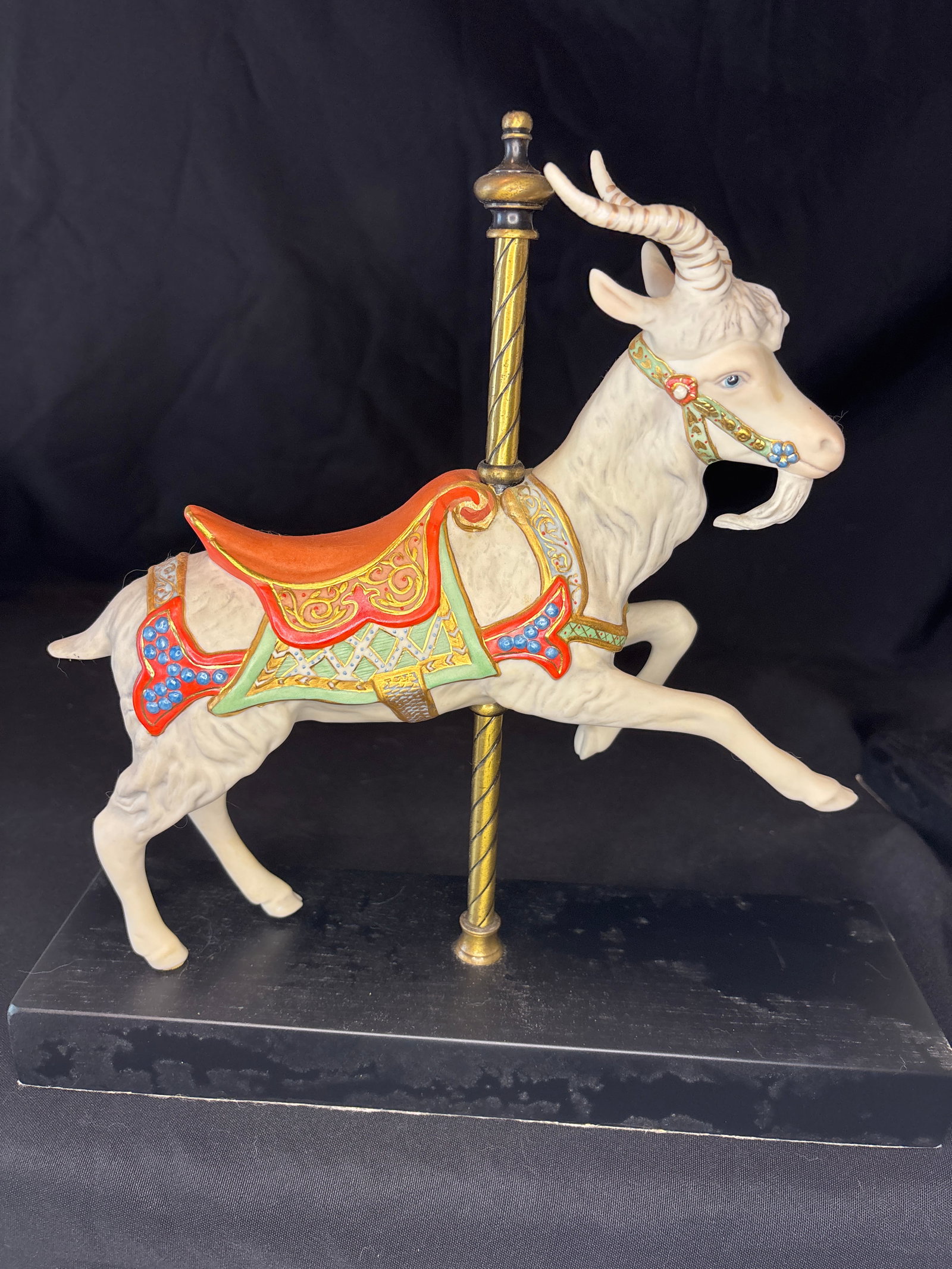 Limited edition Cybis Carousel Goat Porcelain Figurine: Cybis Porcelain Carousel Goat Figurine, a highly collectible limited-edition bisque porcelain sculpture.Key Details & BackgroundArtist & Series: Sculpted by artist Susan Clark Eaton as part of the stu