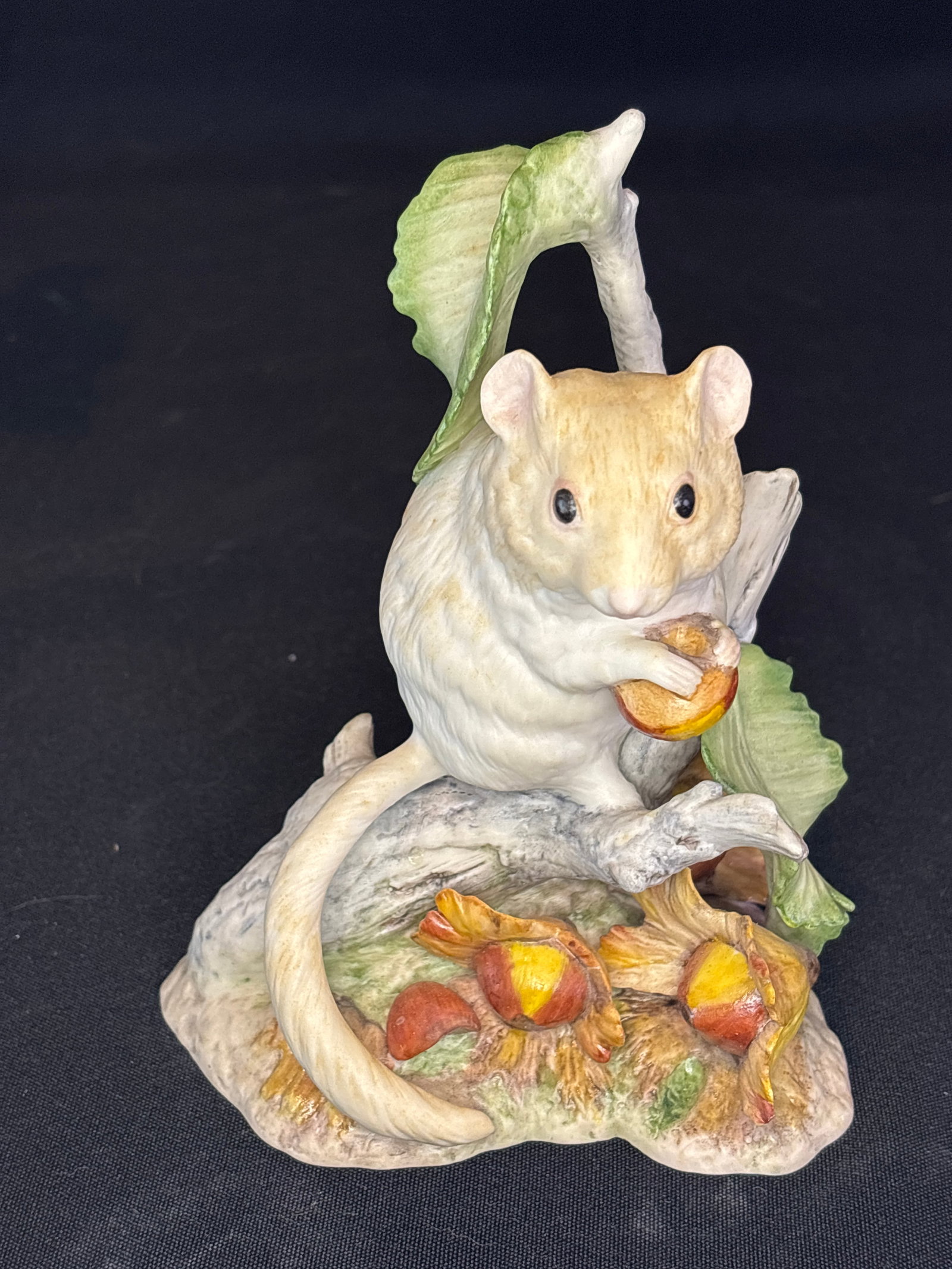 Cybis Dormouse Maxine; vintage porcelain dormouse 6 inch figurine: vintage porcelain dormouse figurine, likely the Cybis Dormouse Maxine or a similar piece from the Cybis Porcelain studio, featuring a light-colored mouse holding an acorn among foliage