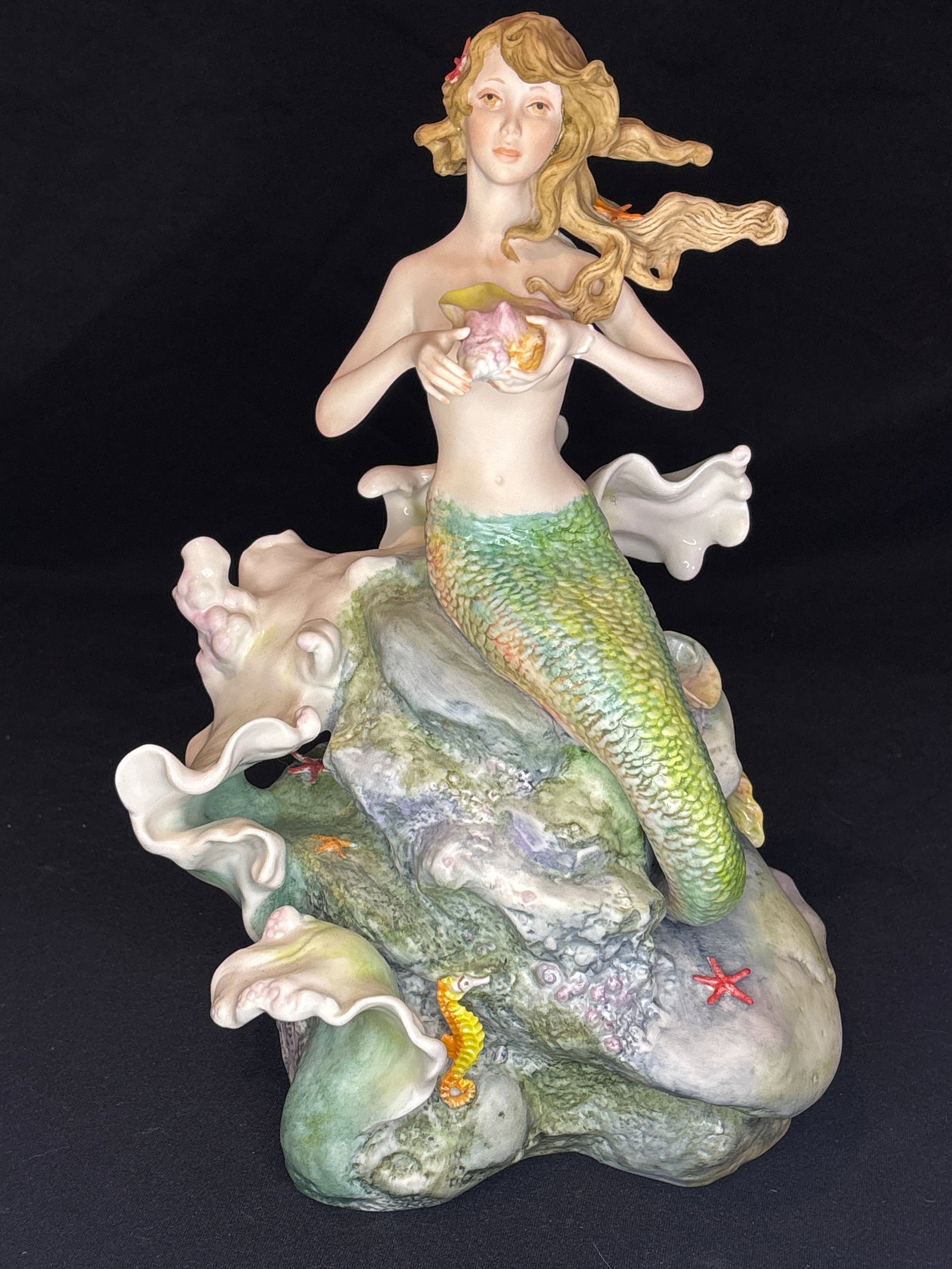 Limited edition Cybis porcelain ""Mermaid on Rocks" 12.5 inch statue: Cybis bisque porcelain mermaid figurine, officially known by titles such as "Sea Nymph" or "Mermaid on Rocks".Produced by the renowned Cybis Porcelain Studio, this delicately detailed piece features a