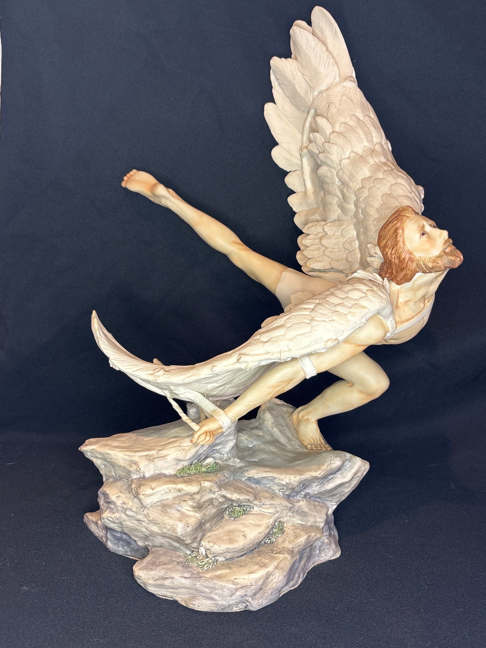 Rare colorway Cybis porcelain Icarus from "Classical Impressions" series 19 inch statue: This stunning piece is the "Icarus" porcelain sculpture from the "Classical Impressions" series produced by Cybis Porcelain. The sculpture depicts the tragic Greek mythological figure leaping from a r