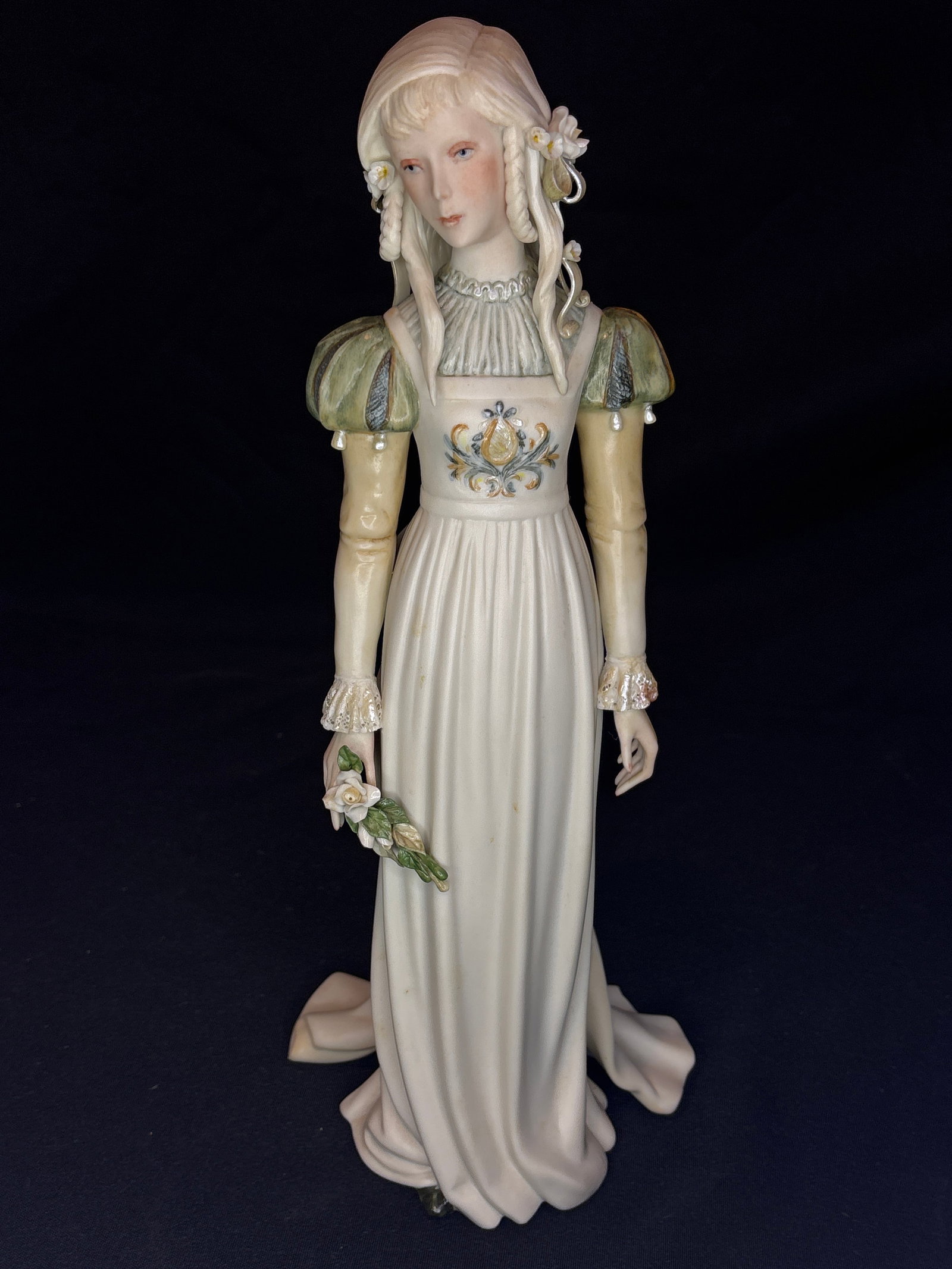 Limited edition Cybis "Ophelia" Shakespearean 13.75 inch sculpture: "Ophelia" (Style 468, Code #NB81), created by the renowned American studio Cybis Porcelain.Introduced in 1969 as part of their limited-edition portraits from literature and Shakespearean plays, the