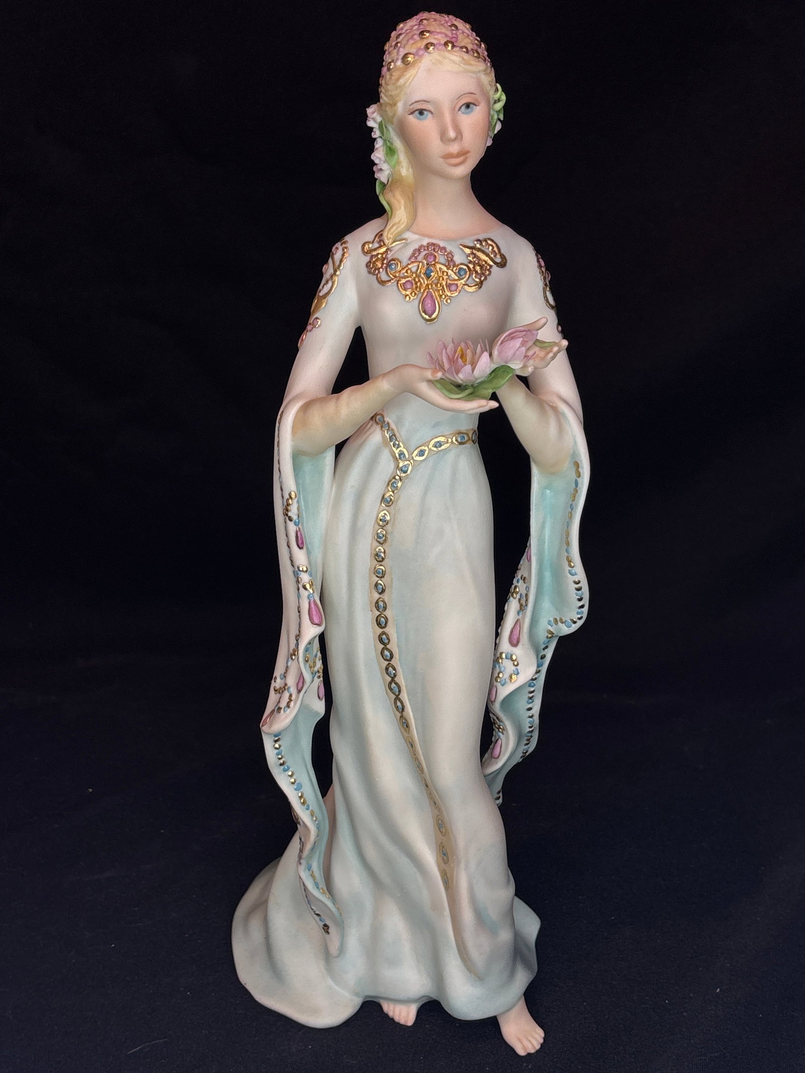 highly collectible, rare limited-edition "Elaine, Lady of the Lake" 14.5inch sculpture: Cybis fine porcelain figurine titled "Elaine, Lady of the Lake" Figurine. Elaine, Lady of the Lake, release Year: Circa 1987. A beautifully detailed woman sculpted in a long flowing, pale celadon-and-