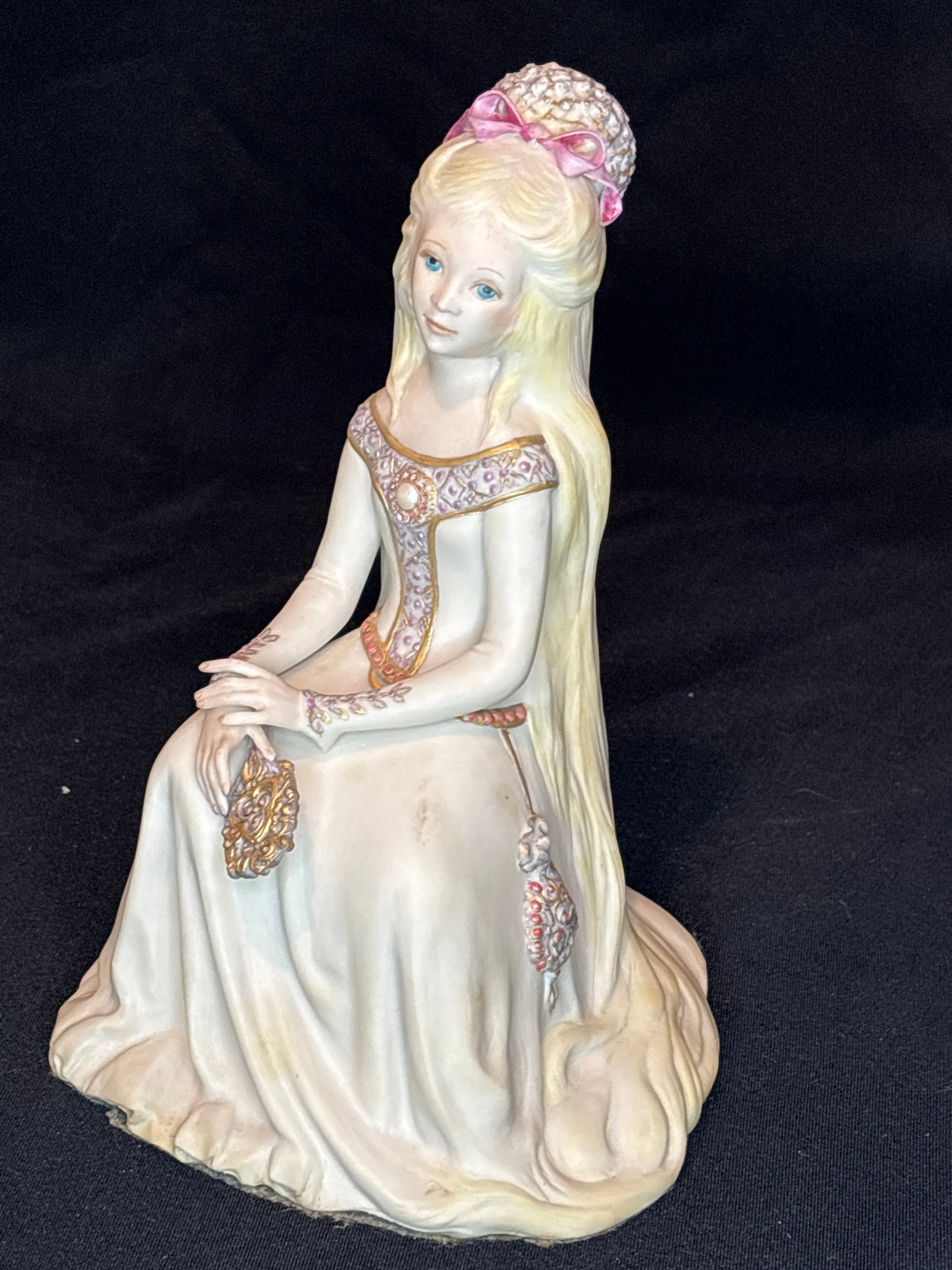 Pink "Rapunzel" Children to Cherish series Cybis porcelain 8.5 inch statue: This fine porcelain piece is the Cybis "Rapunzel" figurine from their popular "Children to Cherish" fairy tale series.Key Details About Your Piece:The Brand: Made by Cybis Porcelain, an American art s